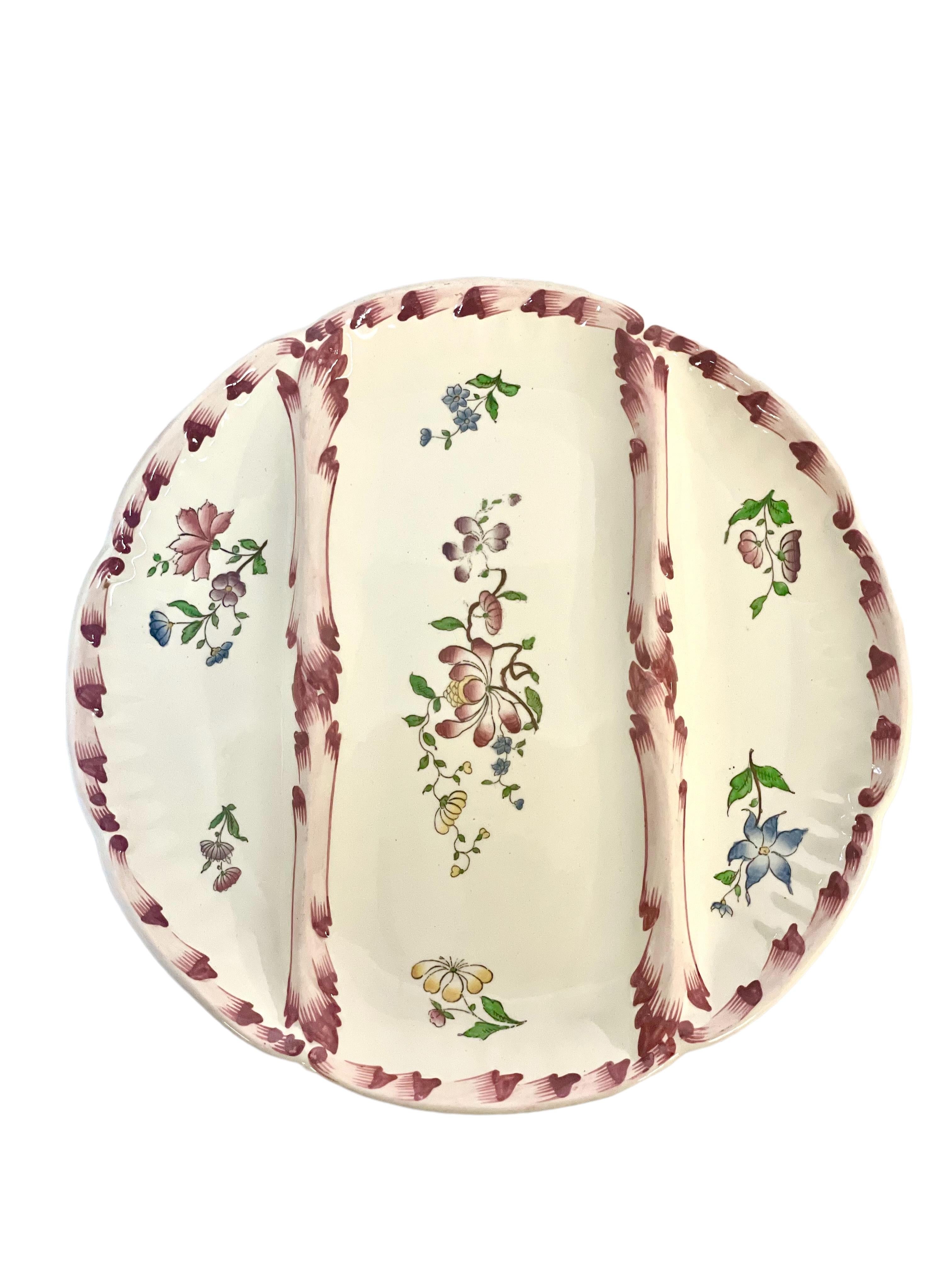 A set of 10 vintage Sarreguemines Majolica asparagus serving plates, from the beginning of the 20th century. Each of these fine earthenware plates has two raised, decorated dividers, which gives each plate three sections, beautifully decorated with