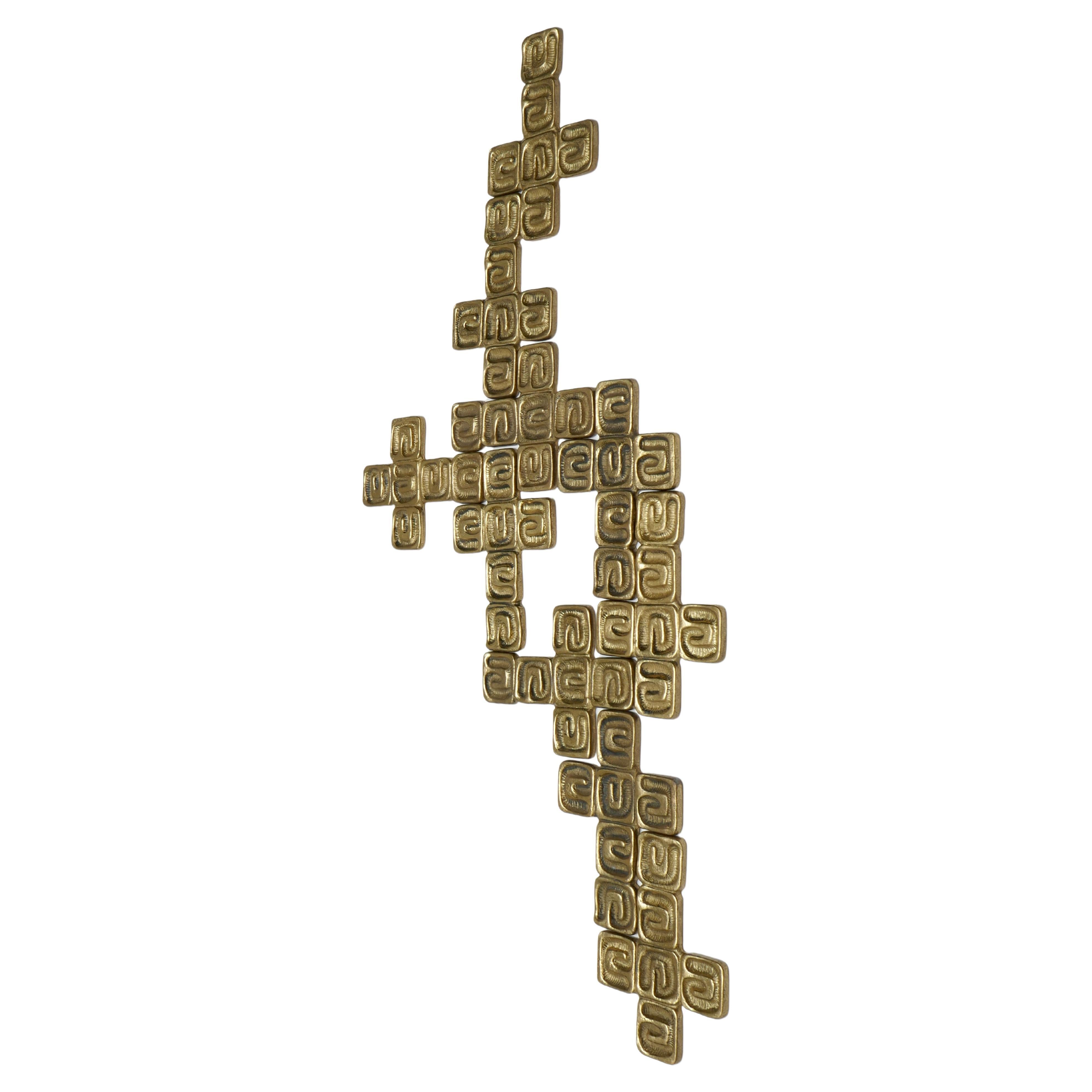 Set of 10 Sculptures by Luciano Frigerio from the 1970s each representing a chiselled brass crucifix. A modular sculpture which can be hung on a wall. You can create your own pattern to adapt it to your space and taste.
You can see a reference to