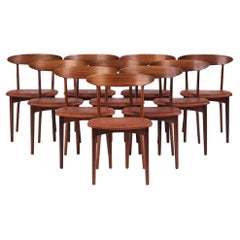 Set of 10 walnut and patinated niger leather dining chairs, by Kurt Østervig