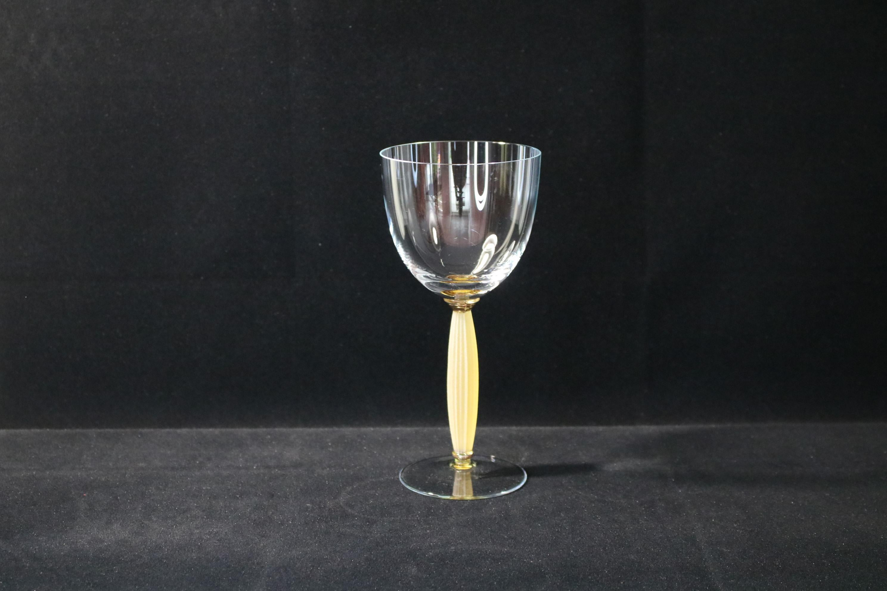 A beautiful and one of a kind set of 10 wine glasses. These were a part of a prototype production run, we were able to save these 10 pieces as the rest was destroyed. The material is sodium potassium glass.