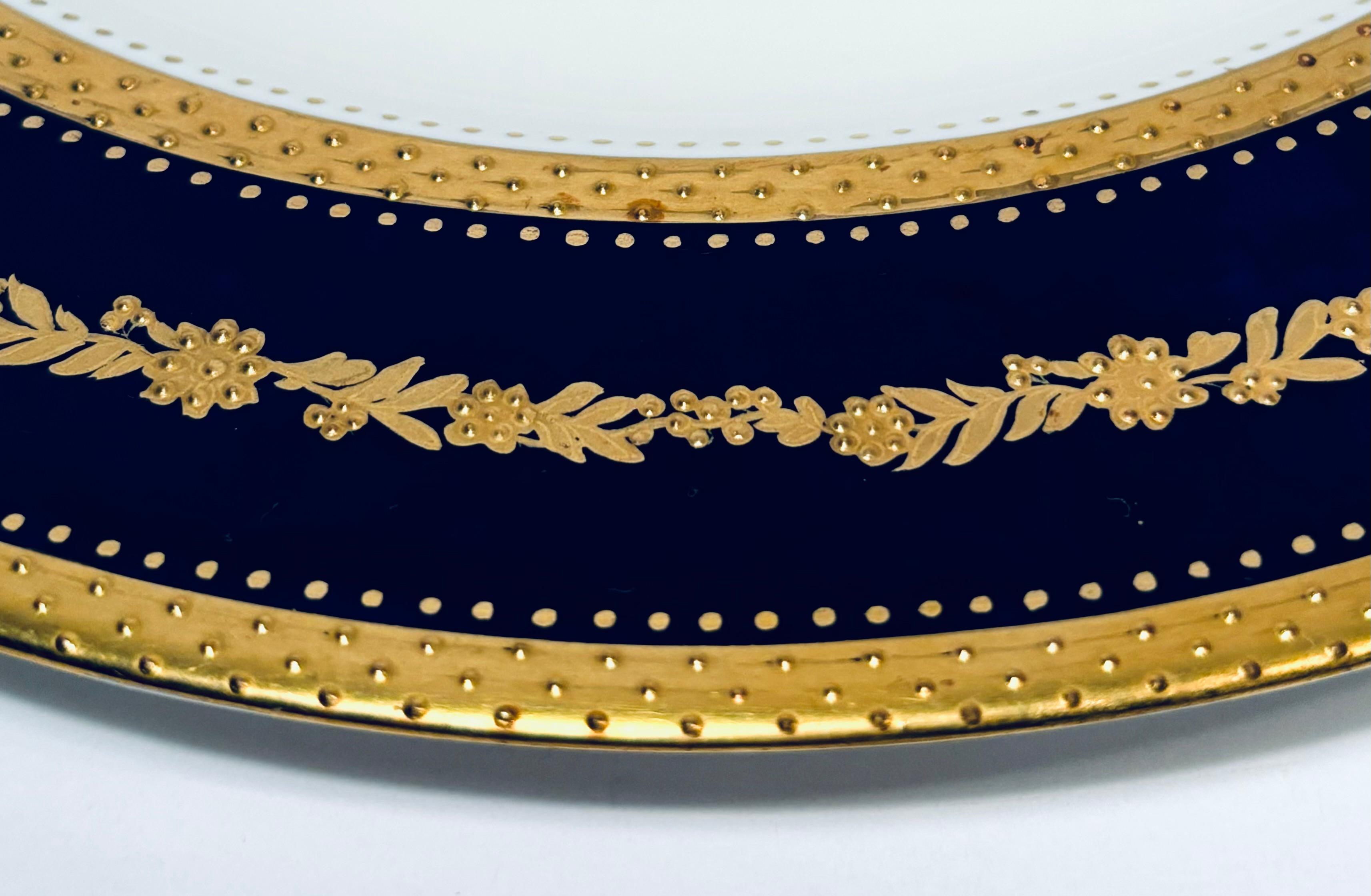 Hand-Crafted Set of 11 Antique English Cobalt Blue & Raised Gold Dinner Plates Circa 1910 For Sale