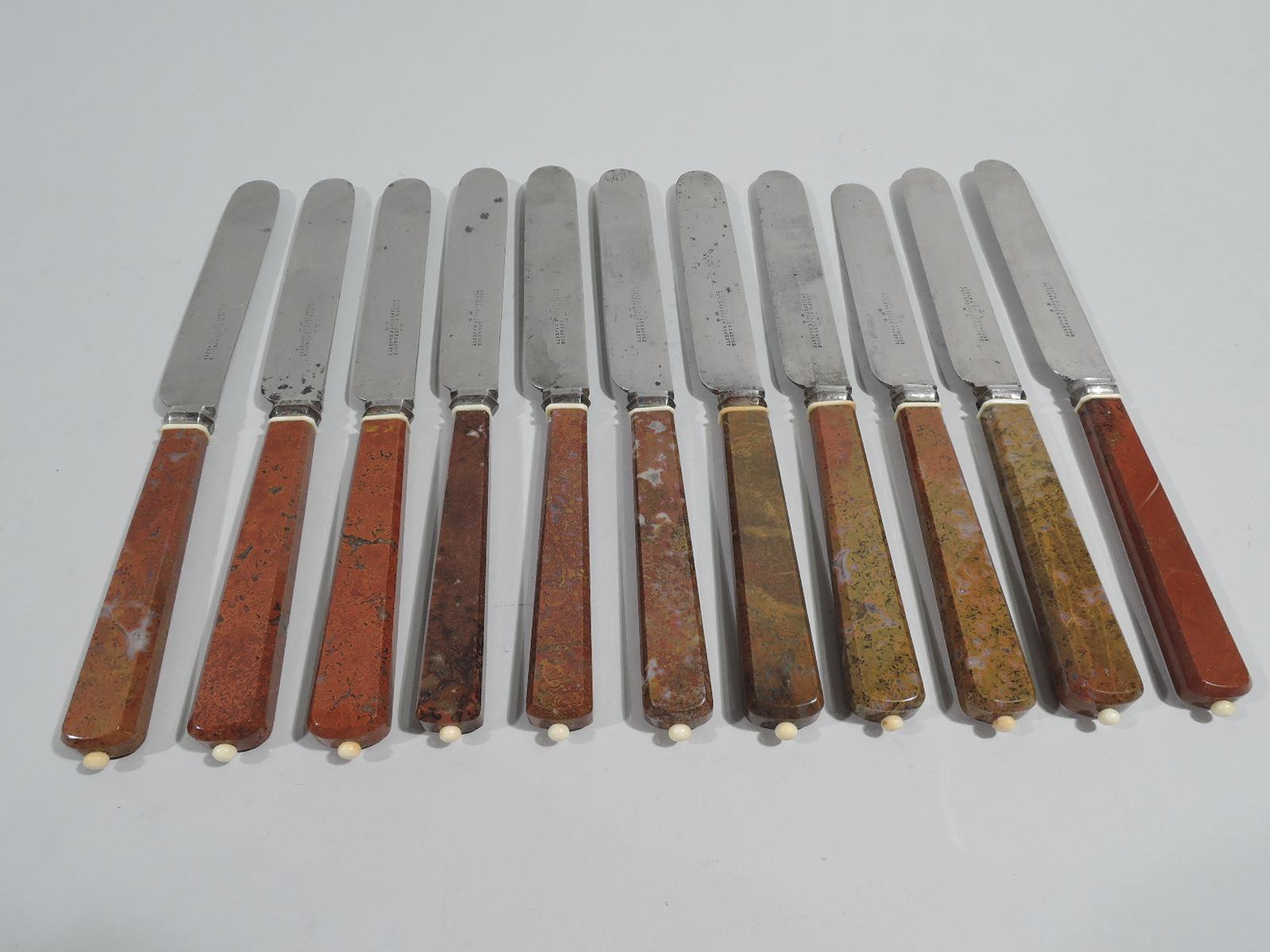 Set of 11 English Victorian dinner knives, ca 1880. Each: Tapering and chamfered rectilinear agate handle with bead terminal and silver-plated blade. Agate red and mottled in varying shades. Blades marked “Joseph Rodgers & Sons / Cutlers to Her