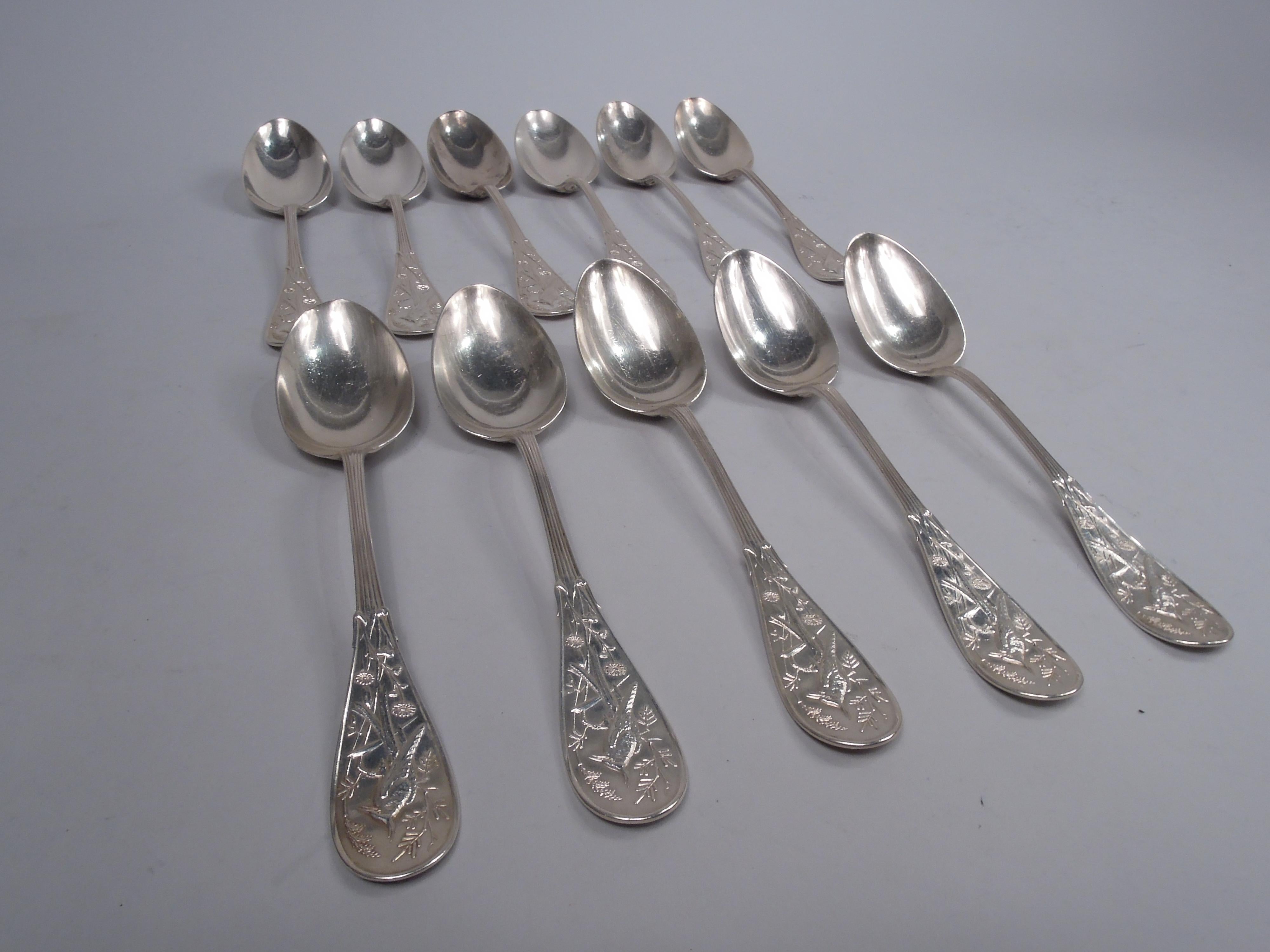 Set of 11 Japanese sterling silver tablespoons. Made by Tiffany & Co. in New York, ca 1875. Reeded handle and oval terminal; double-sided low-relief stylized ornament with perched bird, flowers, leafing stalks, and cattails. The pattern was patented