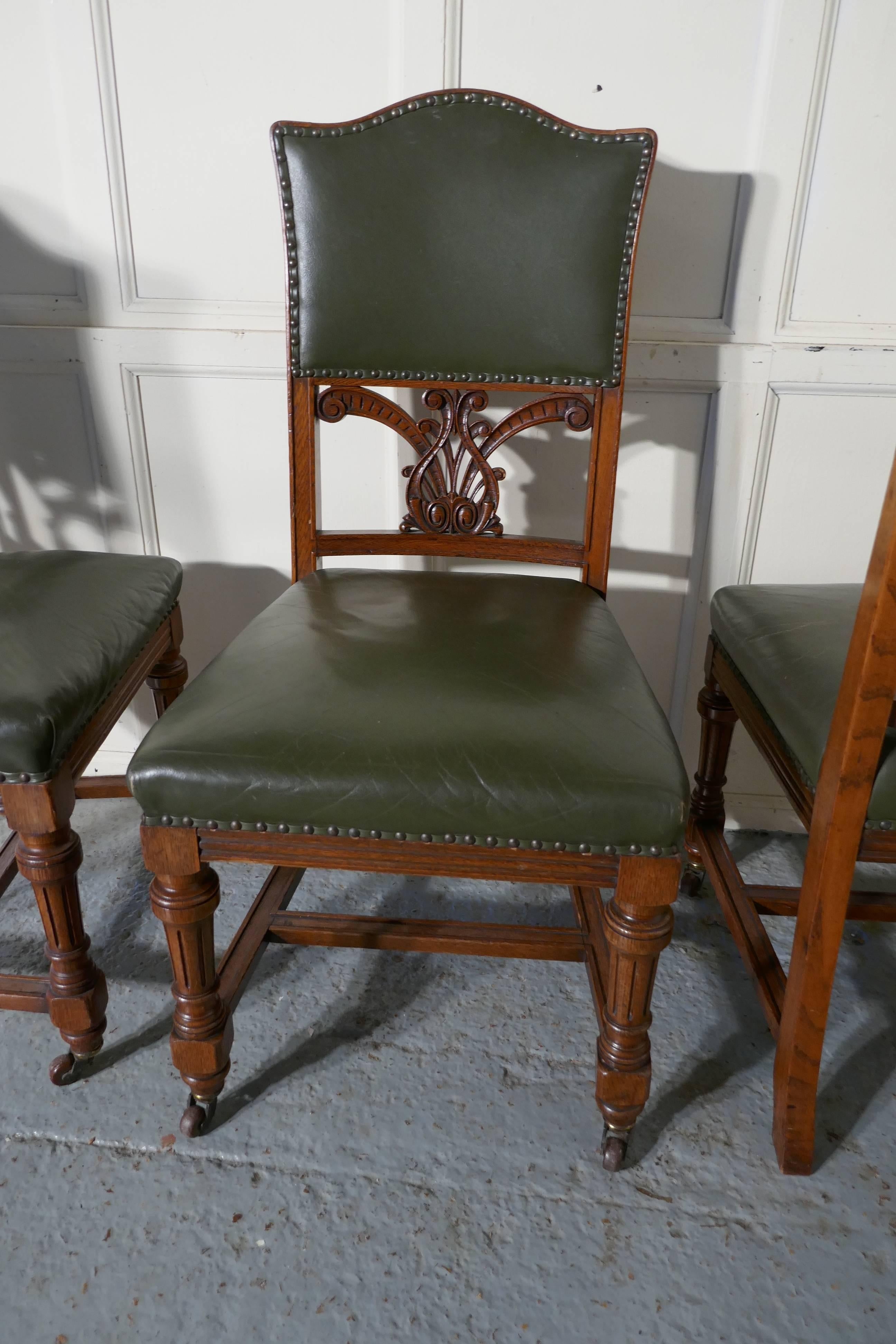 Set of 11 Arts & Crafts golden oak and leather dining chairs 
 
This is a superb quality heavy weight set of dining chairs, they are made in golden oak and upholstered in soft bottle green leather hide
The set has 11 single chairs, they have a