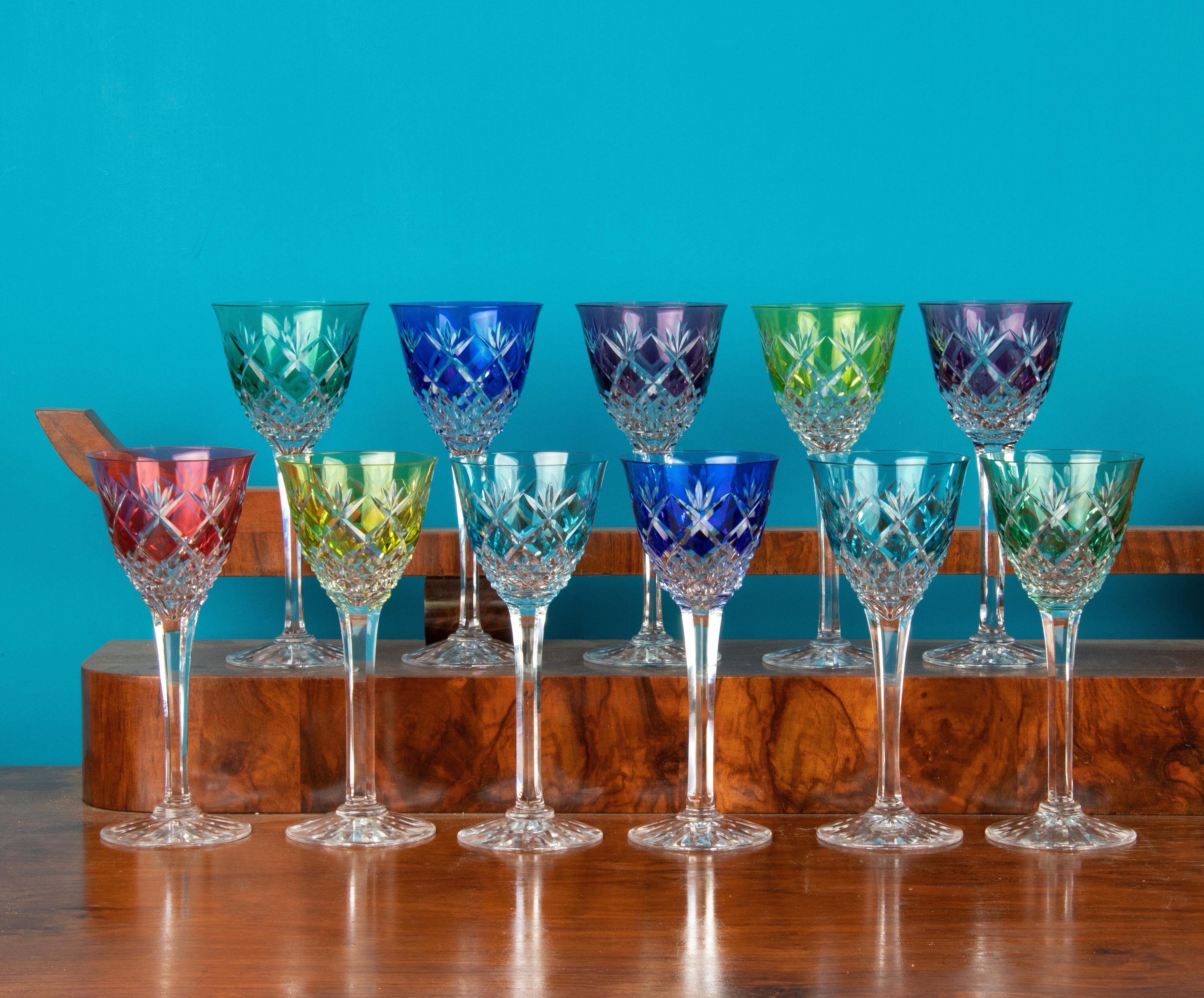 Beautiful set of 11 crystal French wine glasses. With beautiful grinding work. Nice quality, very bright colours. The set is in very good condition.