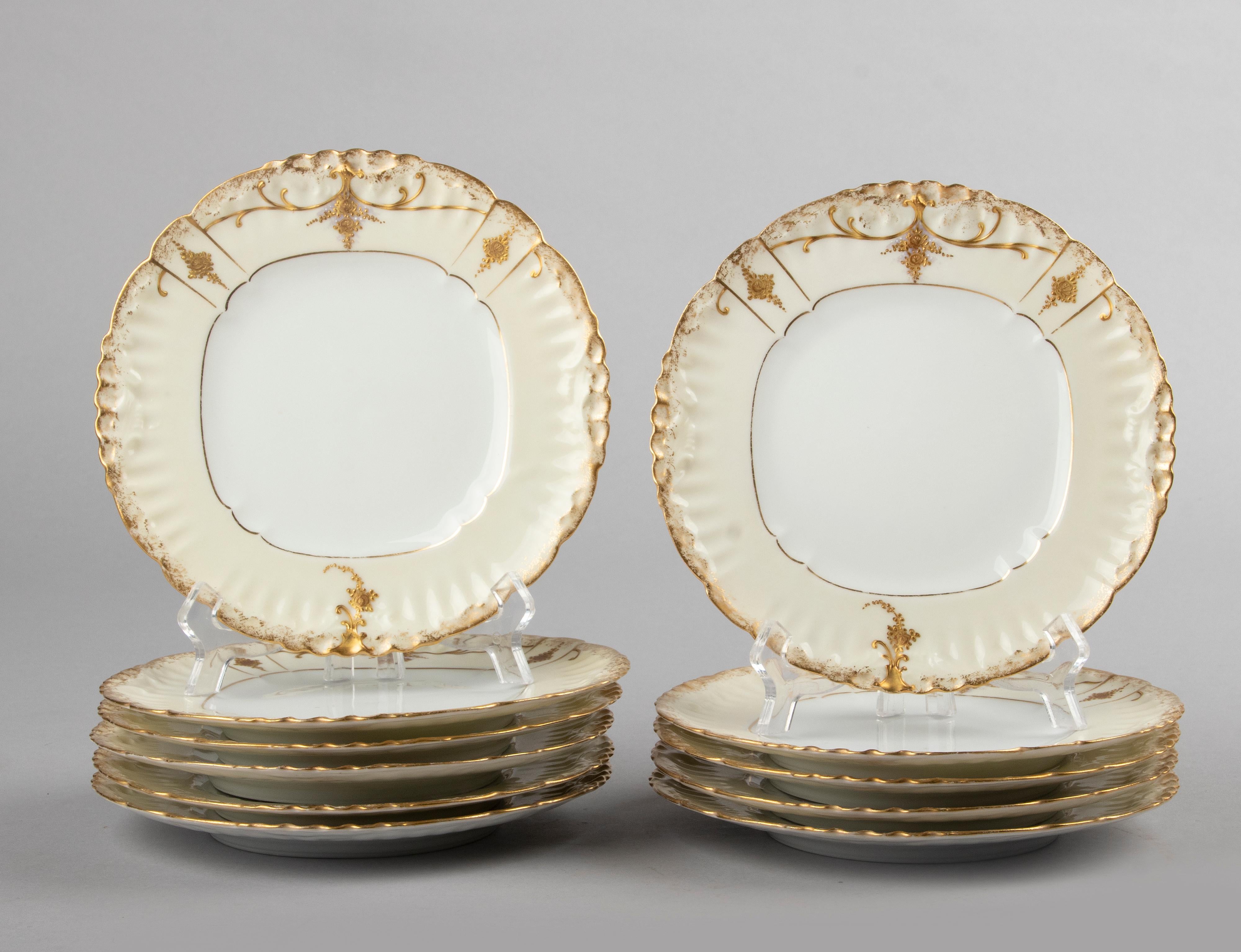 Beautiful set of eleven antique porcelain dessert plates from the French brand Limoges. The plates have beautiful gold-plated decoration in romantic Art Nouveau style. The plates date from about 1900. All in good condition. No chips and no