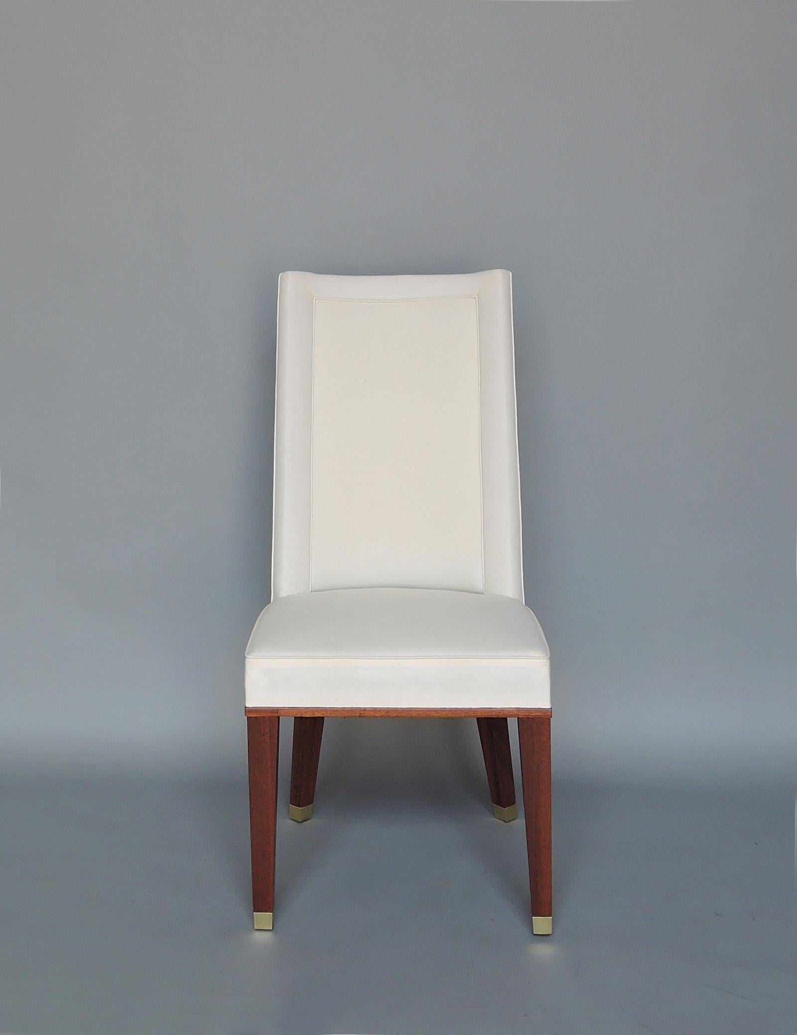 Jacques Adnet (1900–1984) – Set of eleven fine French Mid-Century comfortable mahogany dining chairs with brass sabots.

Provenance: Palais des Consuls of Rouen.

Bibliography: « Jacques Adnet » by Alain-Rene Hardy and Gaelle Millet – Les Editions
