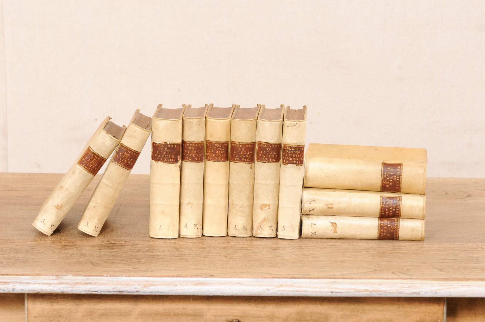 A French set of eleven vellum bound books from the early 18th century. This antique set of six books from France, which were published in Amsterdam, retain their original vellum bindings and will make fabulous decorative objects. Should you choose