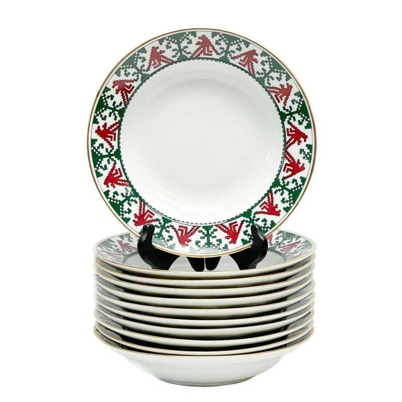 Set of 11 Kornilov Bros Imperial Russian Porcelain Rimmed Soup Bowls, c. 1915

11 Kornilov Bros Imperial Russian porcelain rimmed soup bowls in pattern N8, circa 1915. A white ground with red and green geometric patterns to the edge. Gilt to the
