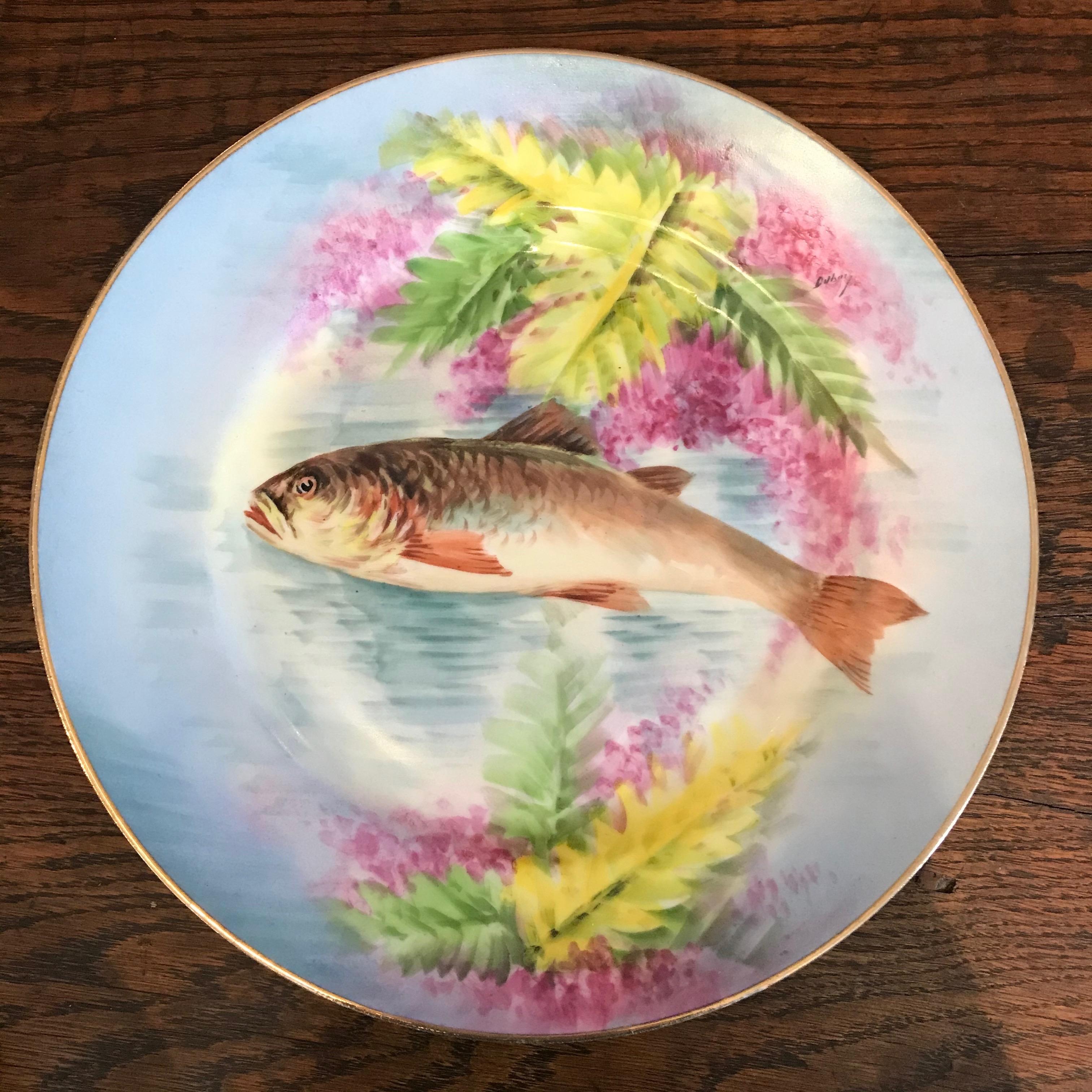 Set of eleven gorgeous Limoges France Aesthetic Movement plates having various fish hand painted designs. Porcelain china with 22-karat gold gilt edges, circa 1890. B.R maker’s mark on the back. Each piece is a work of art.
#4661.
   
  