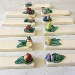 Set of 11 Majolica Knife Rests with Fruits