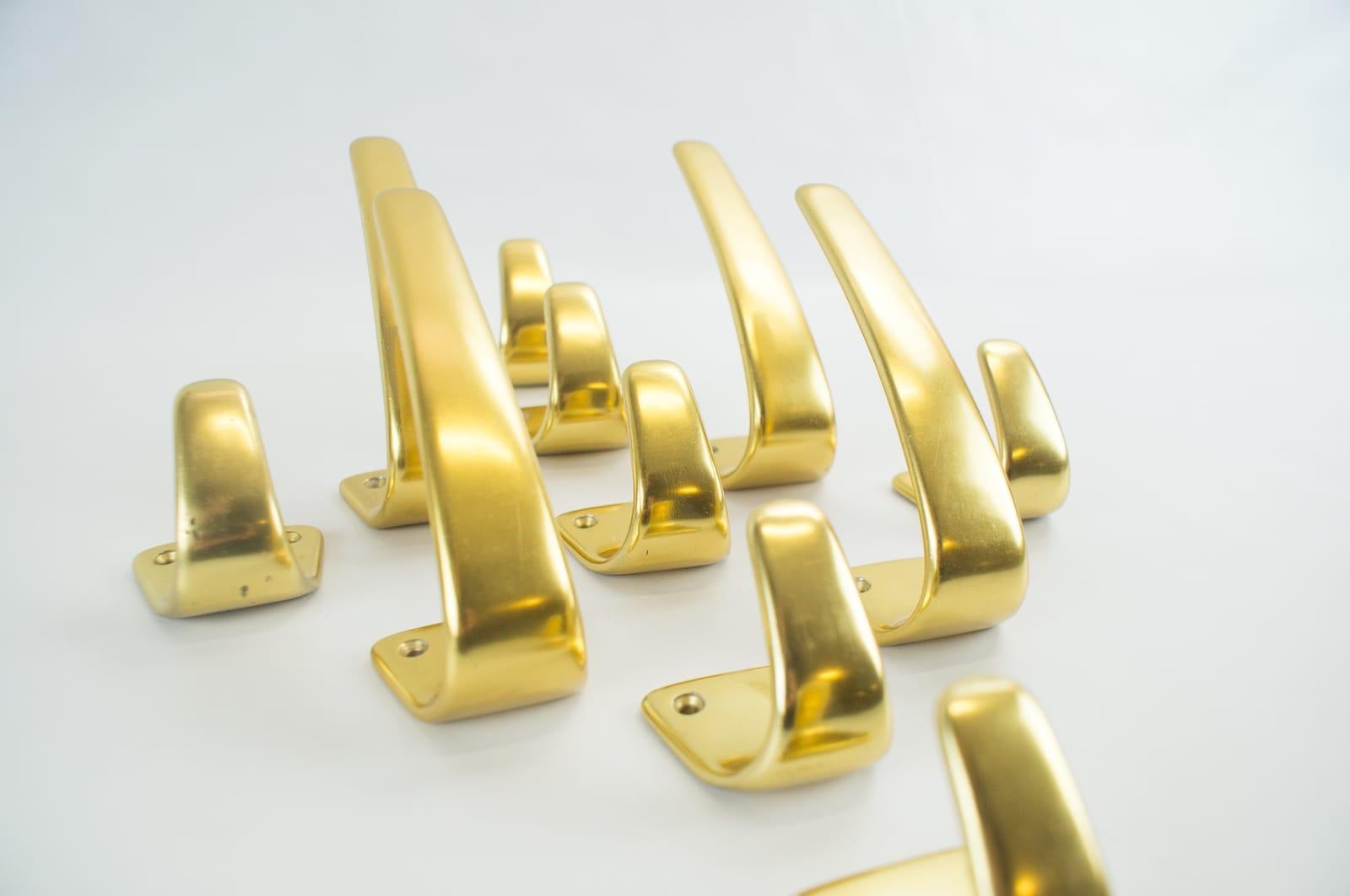 Set of 11 Midcentury Brass Wall Hooks Attributed to Carl Auböck, Austria, 1950s 1
