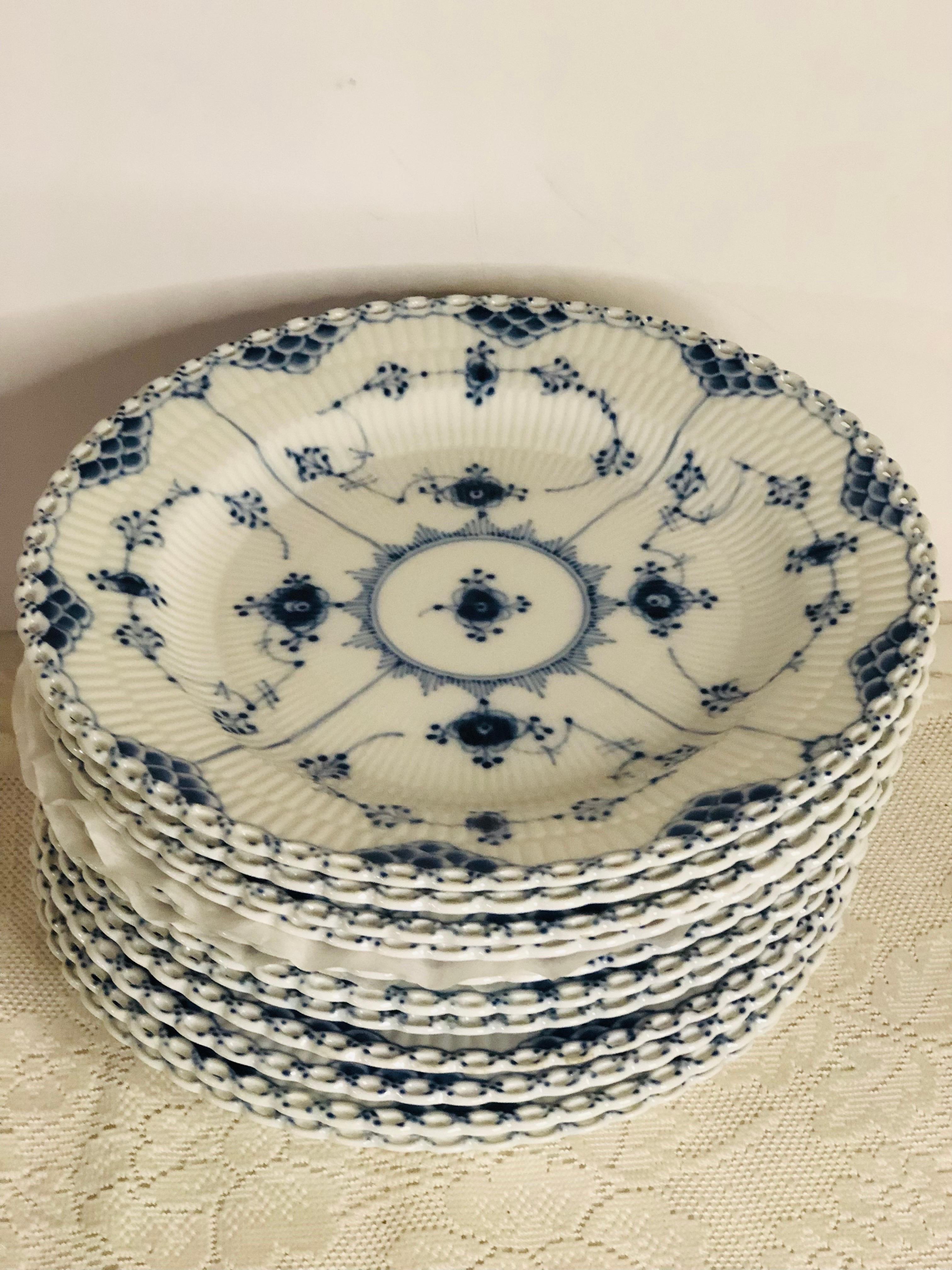 I want to offer you this fabulous set of eleven Royal Copenhagen fluted dinner plates with full lace openwork design on the borders. This full lace fluted dinnerware was the first dinner service sold by Royal Copenhagen in 1775. In 1885, the