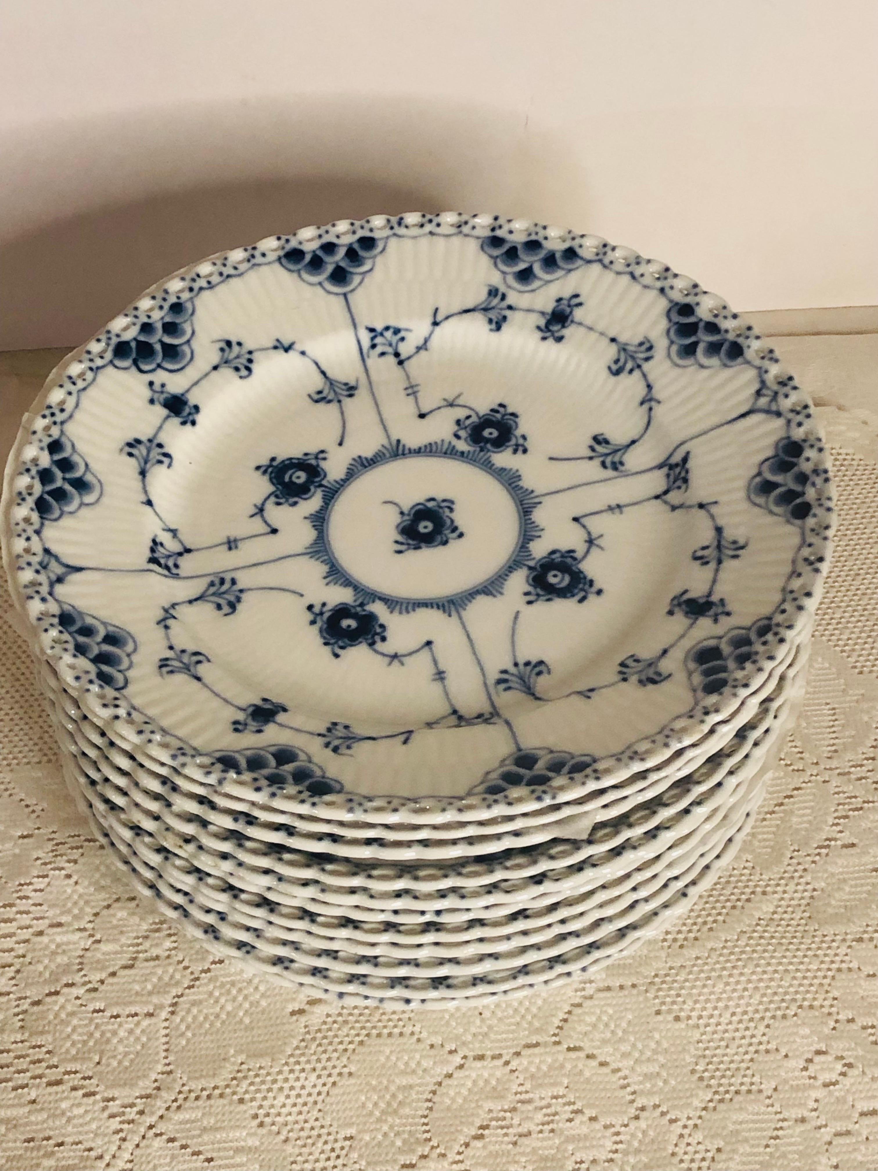 I want to offer you this fabulous set of eleven Royal Copenhagen fluted luncheon or dessert plates with full lace openwork design on the borders. This full lace fluted dinnerware was the first dinner service sold by Royal Copenhagen in 1775. In