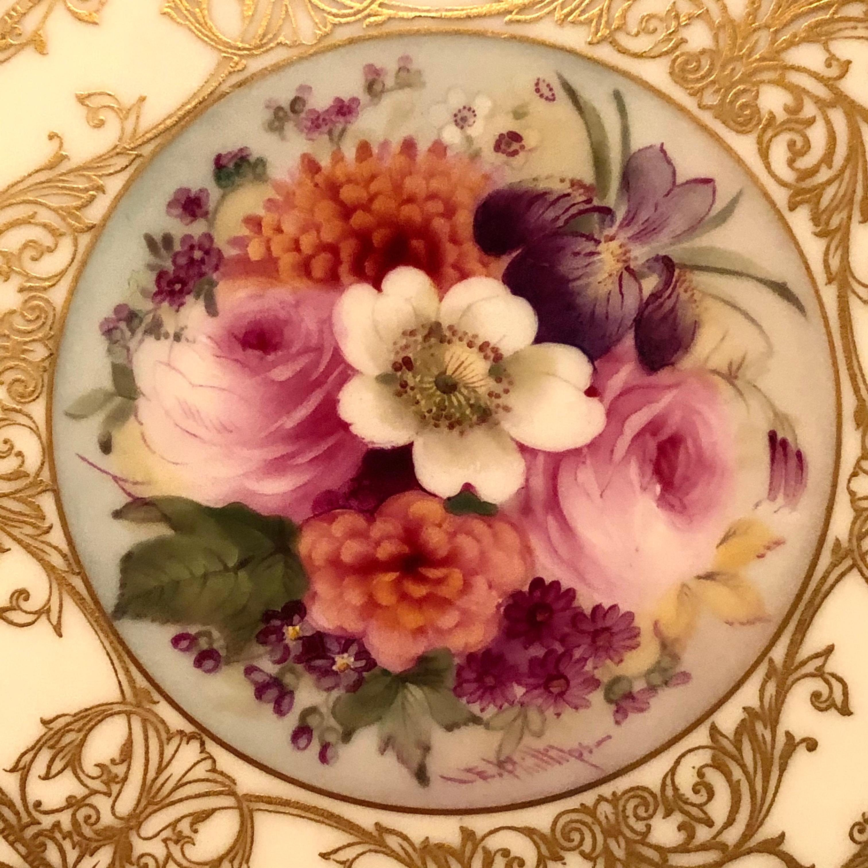This is a stunning set of Royal Worcester dinner plates, each hand painted with different beautiful flower bouquets. These plates are artist signed E. Phillips, who was an artist who specialized in painting flowers at the Royal Worcester company.