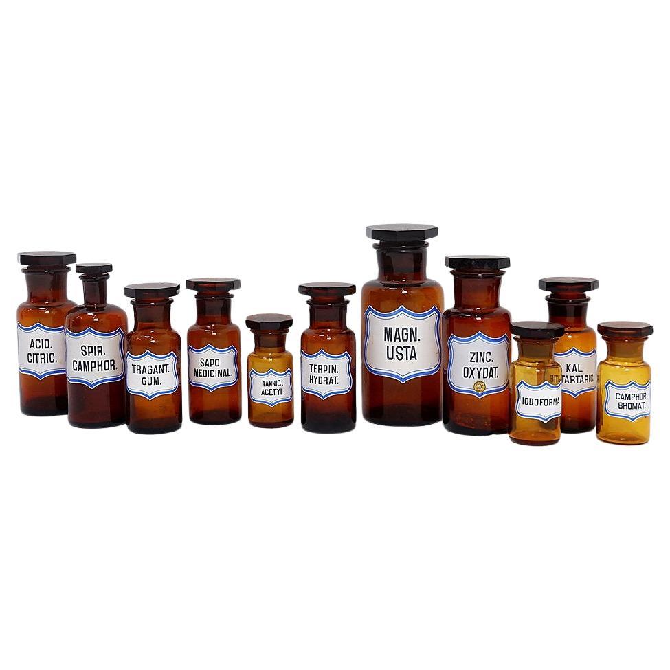 Set of 11 vintage amber glass pharmacy bottles collection