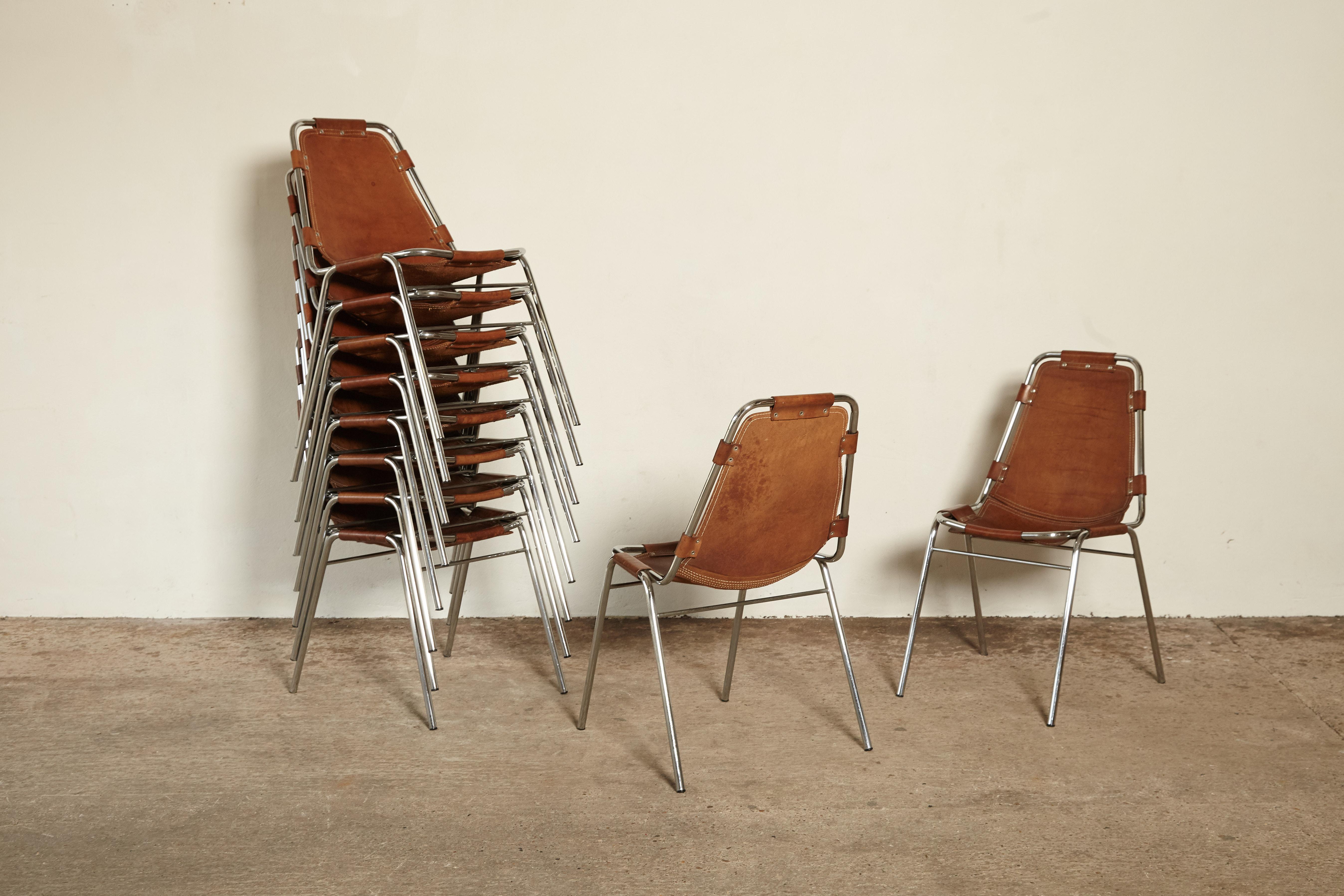 'Les Arcs' chairs in tubular steel and cognac leather, France/Italy, 1970s. Sold as a set of twelve, ten, eight or six. Patinated original leather. Some marks. Some examples marked on the underside.

Les Arcs was a project on