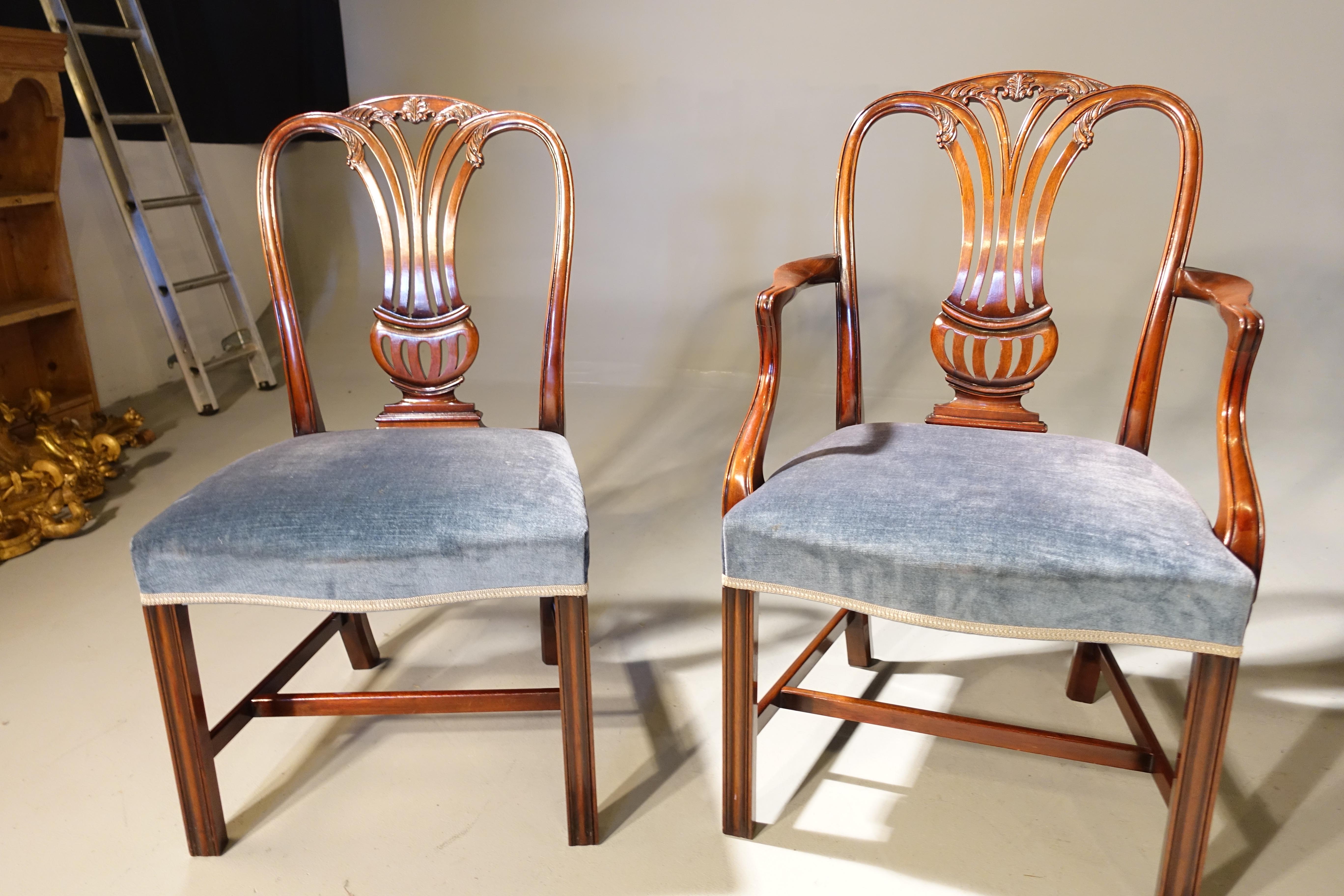 A set of 12 (10+2) elbow chairs of Hepplewhite design. The timbers of quite exceptional quality. Mint overall condition. The triple hooped backs with finely executed carving of foliage and flowers. Square chamfered supports. 
Seat height 19