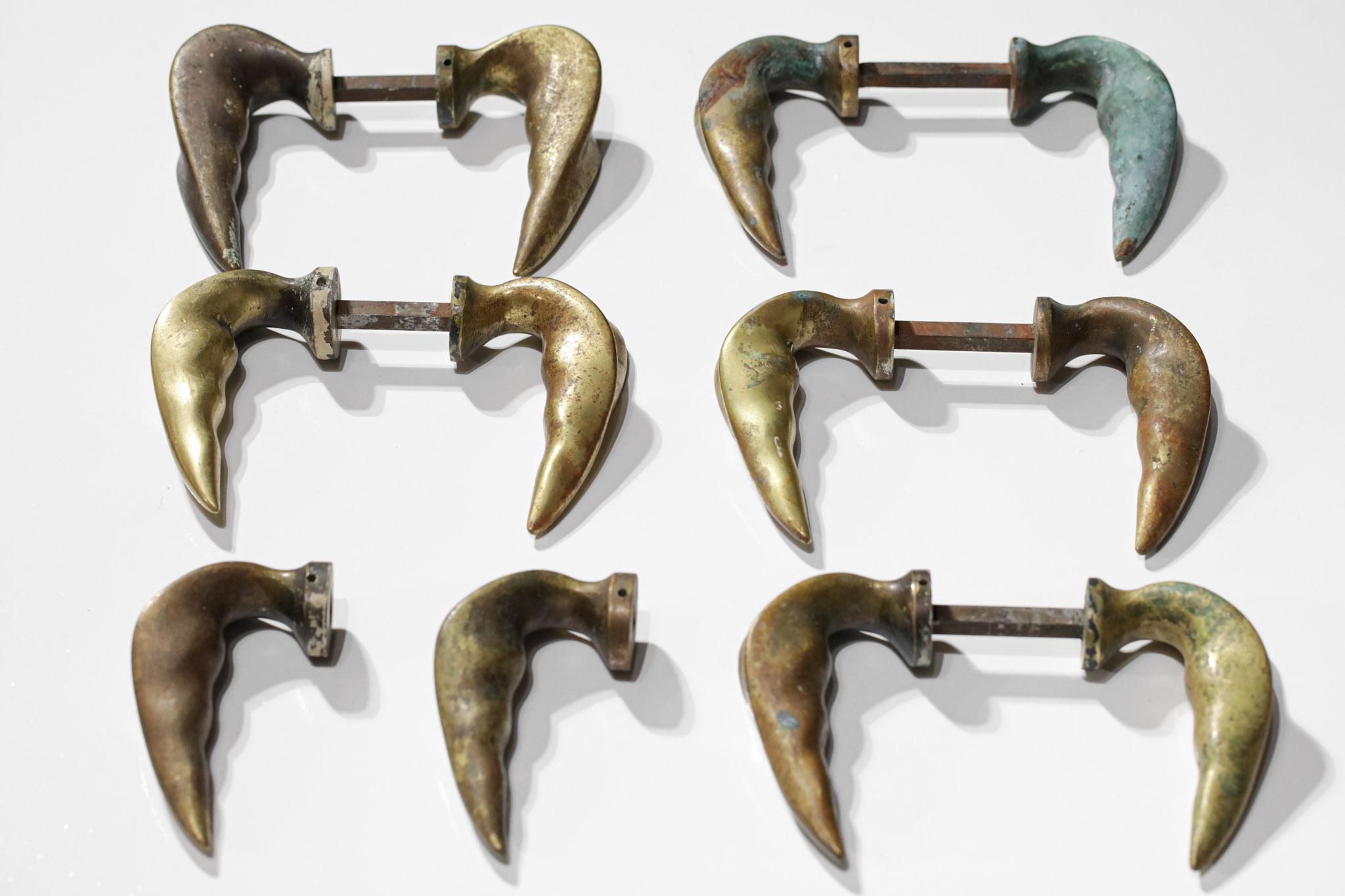 Set of six pairs of Italian bronze door handles from the 1950s. Very nice leaf-shaped handles, nice patina of time on the bronze giving it different shades (see pictures).  Note that one of the pair is missing a pin, and various traces of use on the