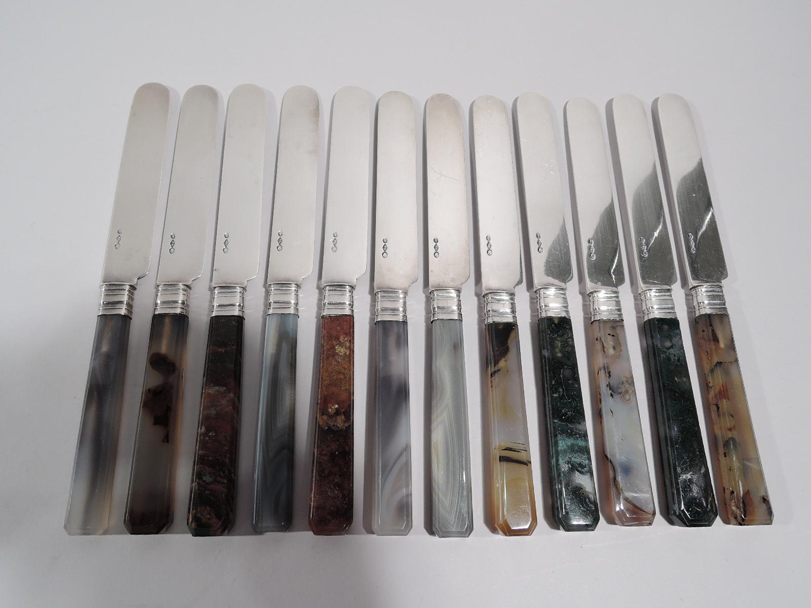 Twelve coin silver and agate dessert knives. Made by Albert Coles in New York, circa 1860. Each: Agate handle with faceted sides and chamfered terminal, and coin silver blade. A gorgeous set in different specimens. Blades marked.