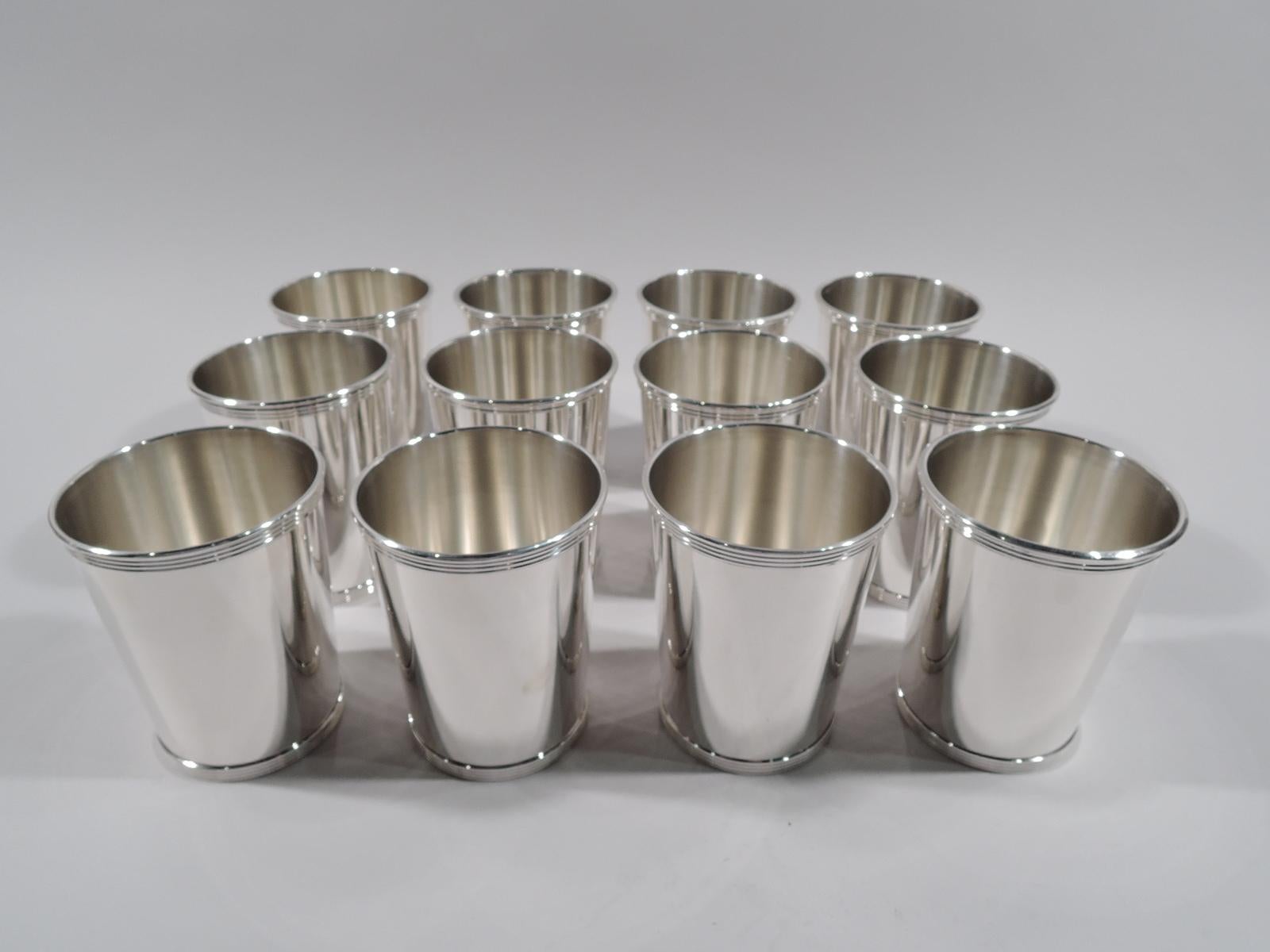 Set of 12 sterling silver mint julep cups. Made by Alvin in Providence. Each: Straight and tapering sides, and reeded rim and foot. Fully marked and numbered S251. Total weight: 46 troy ounces.