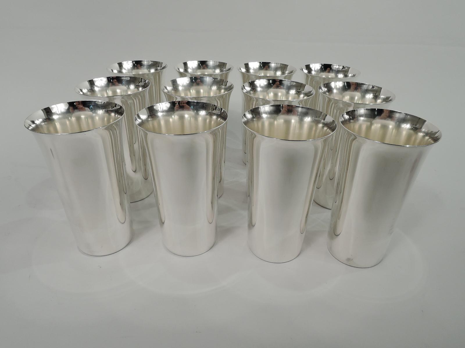 Set of 12 Mid-Century Modern highballs. Made by Manchester in Providence. Each: Straight sides and flared rim. Nice easy-grip form. Fully marked including maker’s stamp and no. 821. Total weight: 52 troy ounces.