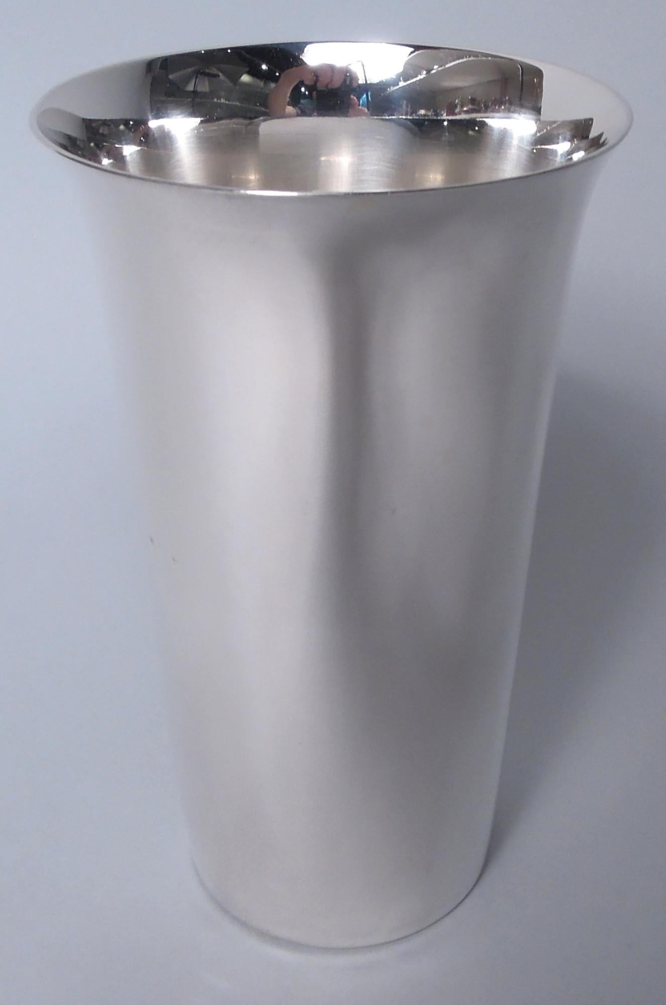 Set of 12 Midcentury Modern sterling silver highballs. Made by Manchester in Providence. Each: Tall and cylindrical bowl with flared mouth rim. Fully marked including maker’s stamp and no. 764. Total weight: 67 troy ounces. 