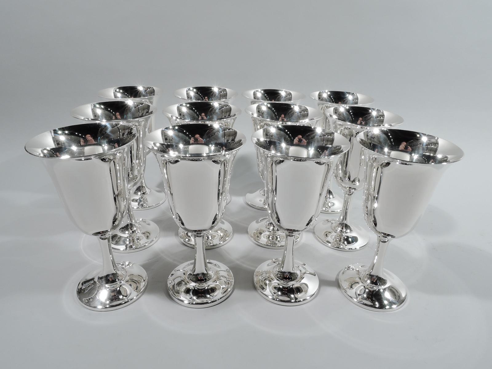 Set of 12 Modern sterling silver goblets. Made by Wallace in Wallingford, Conn. Each: Bell-form bowl with upward tapering stem and round and raised foot. A classic design that make’s any occasion special. Fully marked including maker’s stamp and no.