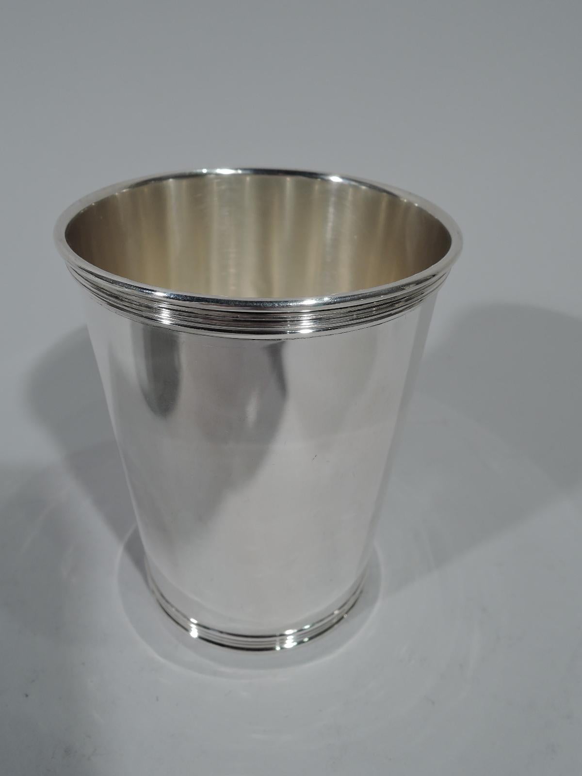 Set of 12 sterling silver mint julep cups. Made by Manchester Silver Co. in Providence. Each: Straight and tapering sides and reeded rim and foot. Hallmark includes no. 3759. Total weight: 46.5 troy ounces.