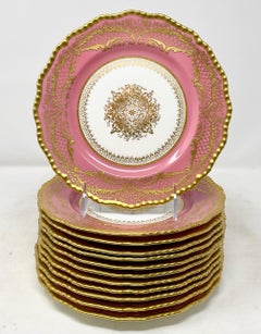 Satz von 12 antiken englischen Royal Doulton Rosa und Gold Porzellan Dessertteller.