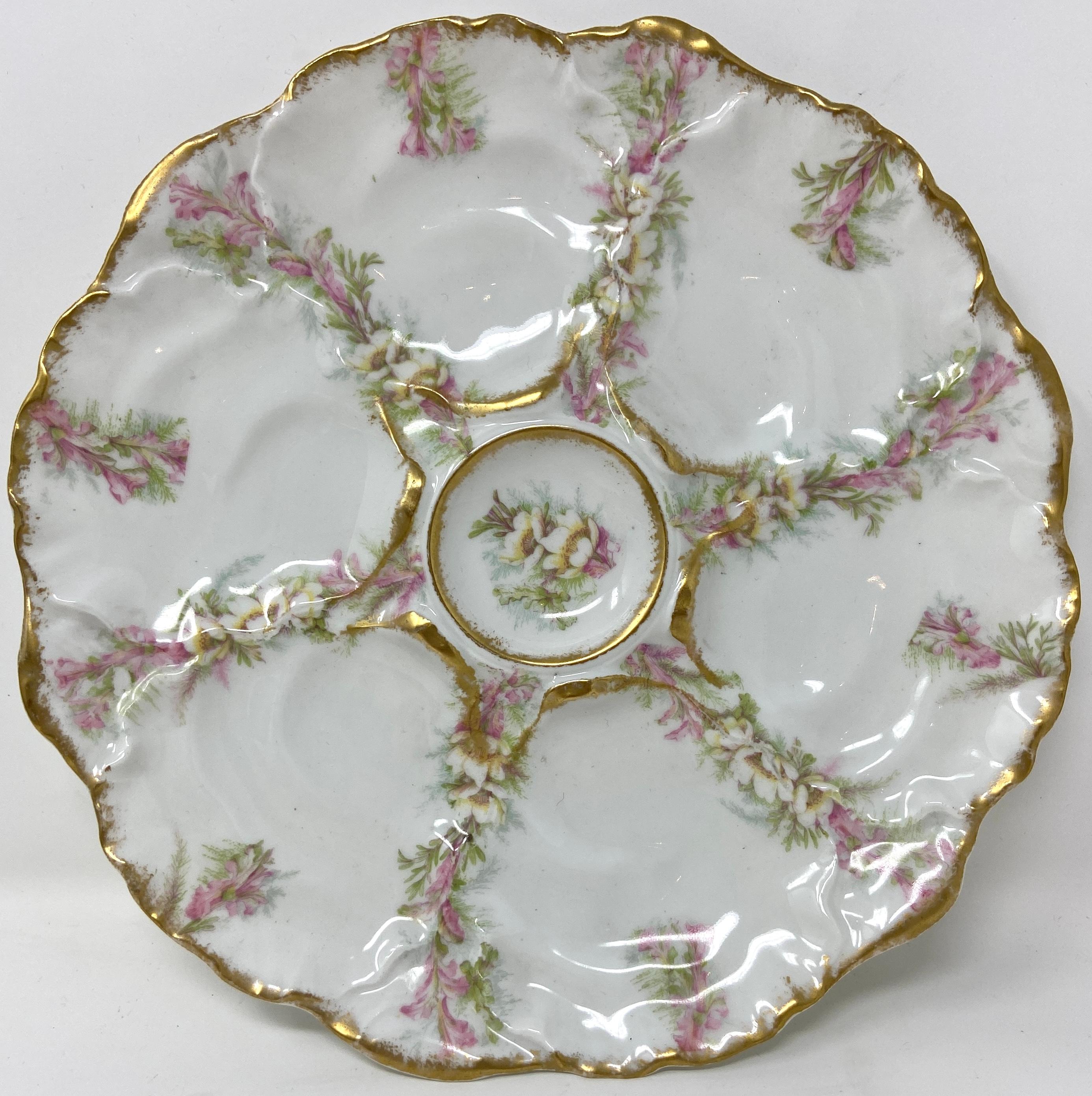Set of 12 antique French limoges porcelain oyster plates, circa 1890-1900.