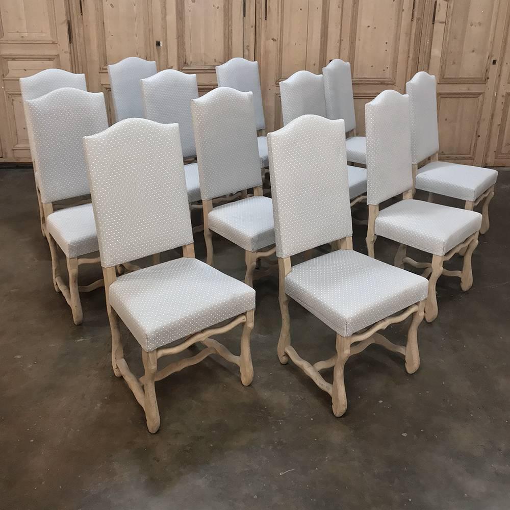 Set of 12 antique French Os de Mouton stripped oak dining chairs are ready to put around your banquet table and start entertaining! Classic styling resembling lamb's legs, hence the French name for the design, was crafted from stripped solid oak and