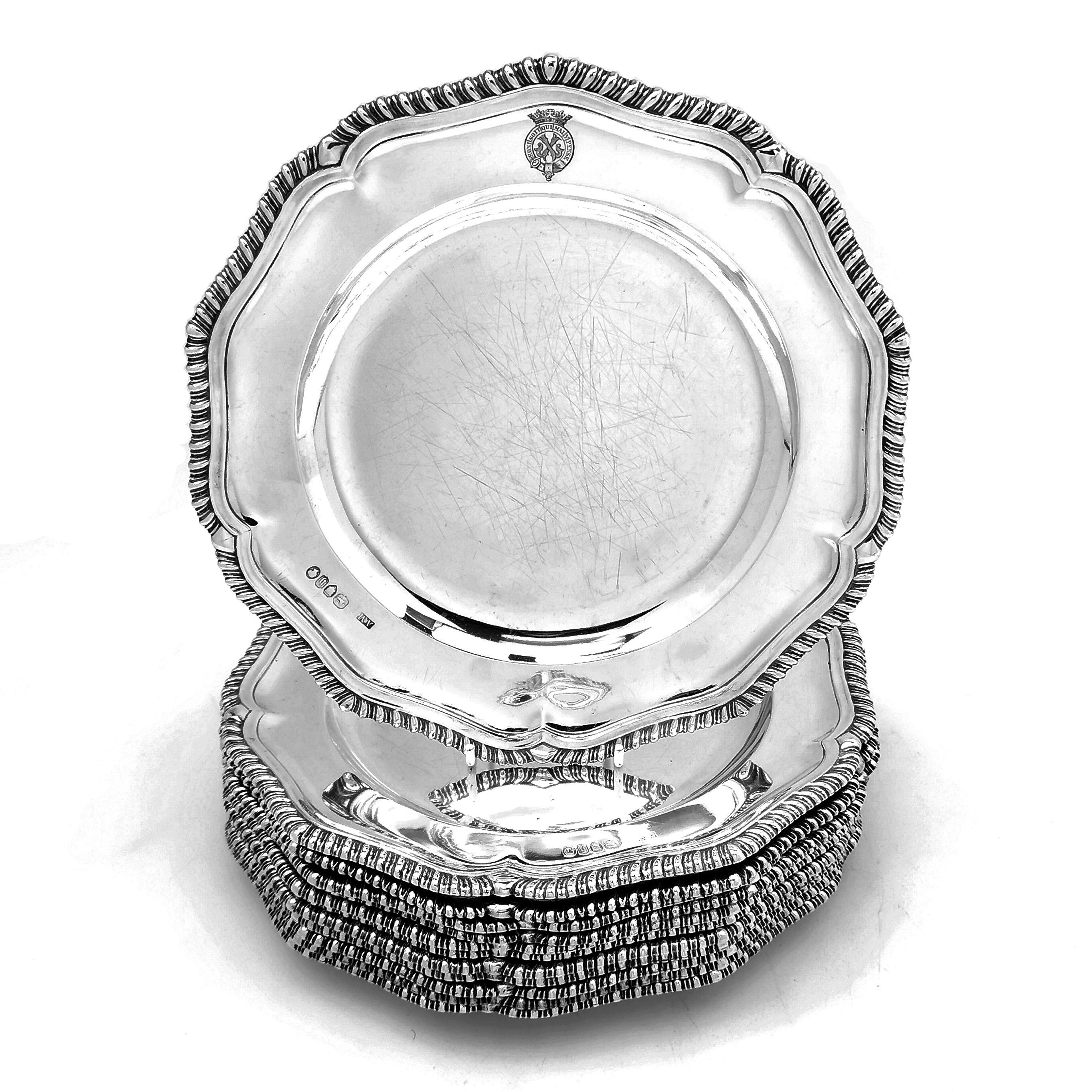A set of 12 classic Antique Victorian Solid Silver Dinner plates with a traditional shaped gadroon edge border. Each Plate has a engraved crest with the words 'Honi soit qui mal y pense' engraved in the symbol of a garter topped with a crown.
The