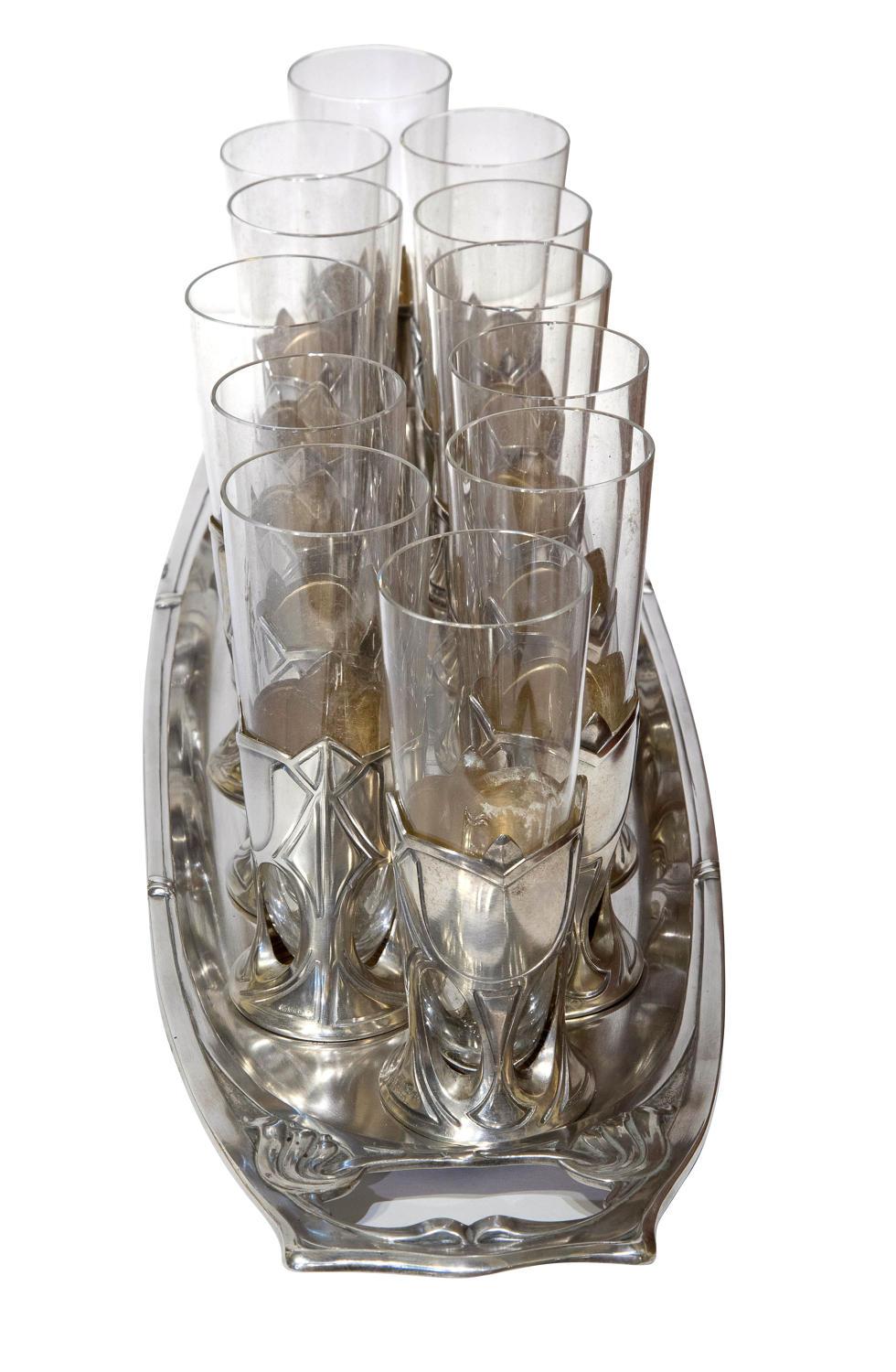 A set of 12 Art Nouveau champagne flutes in silver frames and on their original silver tray by J.Wurm - FREIBURG each bearing German 800 hallmarks, circa 1890
Original glasses, no chips or cracks

Tray size: 49.5cm x 15cm x 1cm.