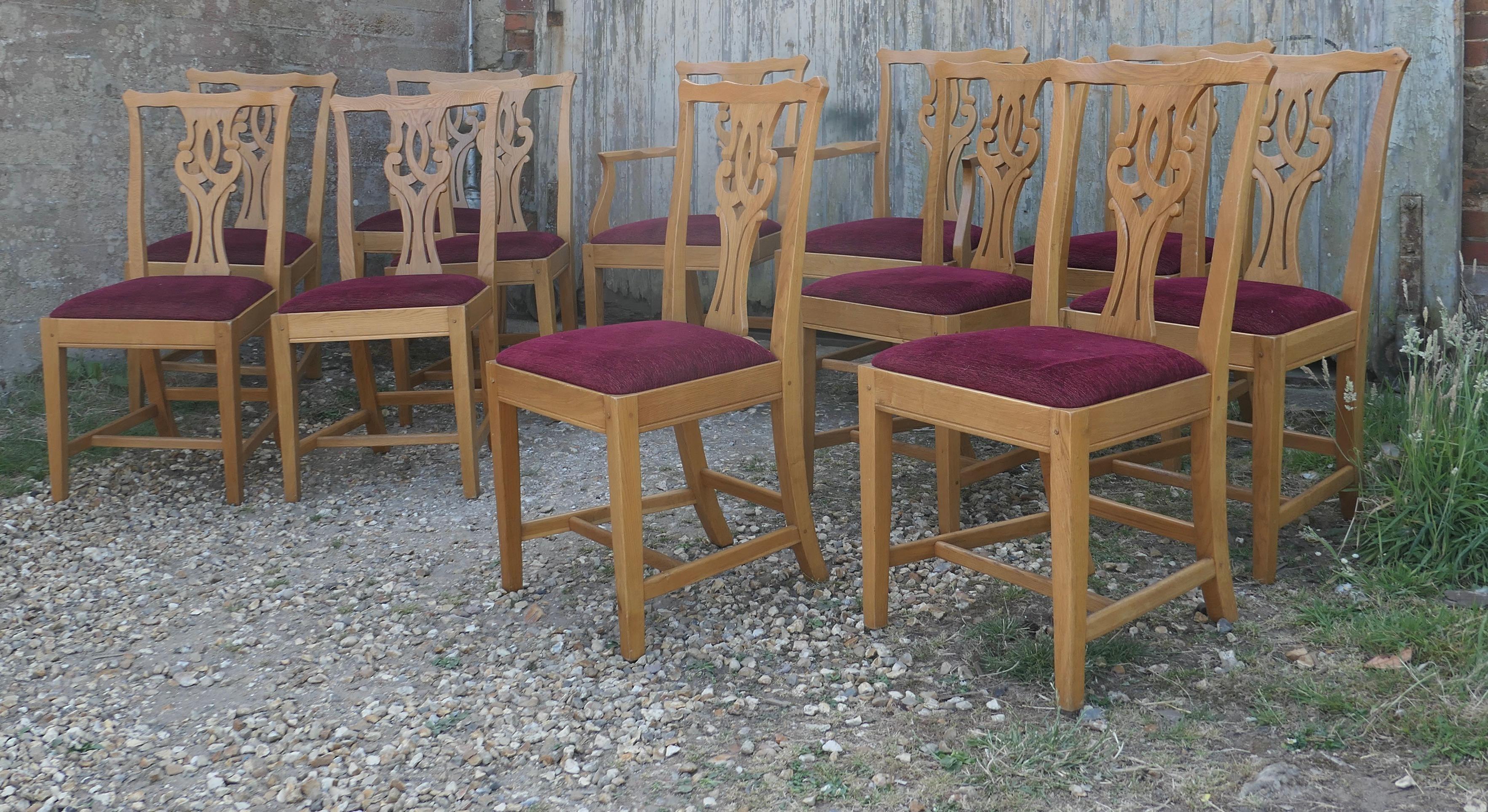 Set of 12 arts and crafts golden oak chippendale dining chairs 
 
This is a superb quality heavy weight set of dining chairs, they are made in Golden Oak 
The chairs are a classic design and made in Golden Oak they have a pierced Back Splat and