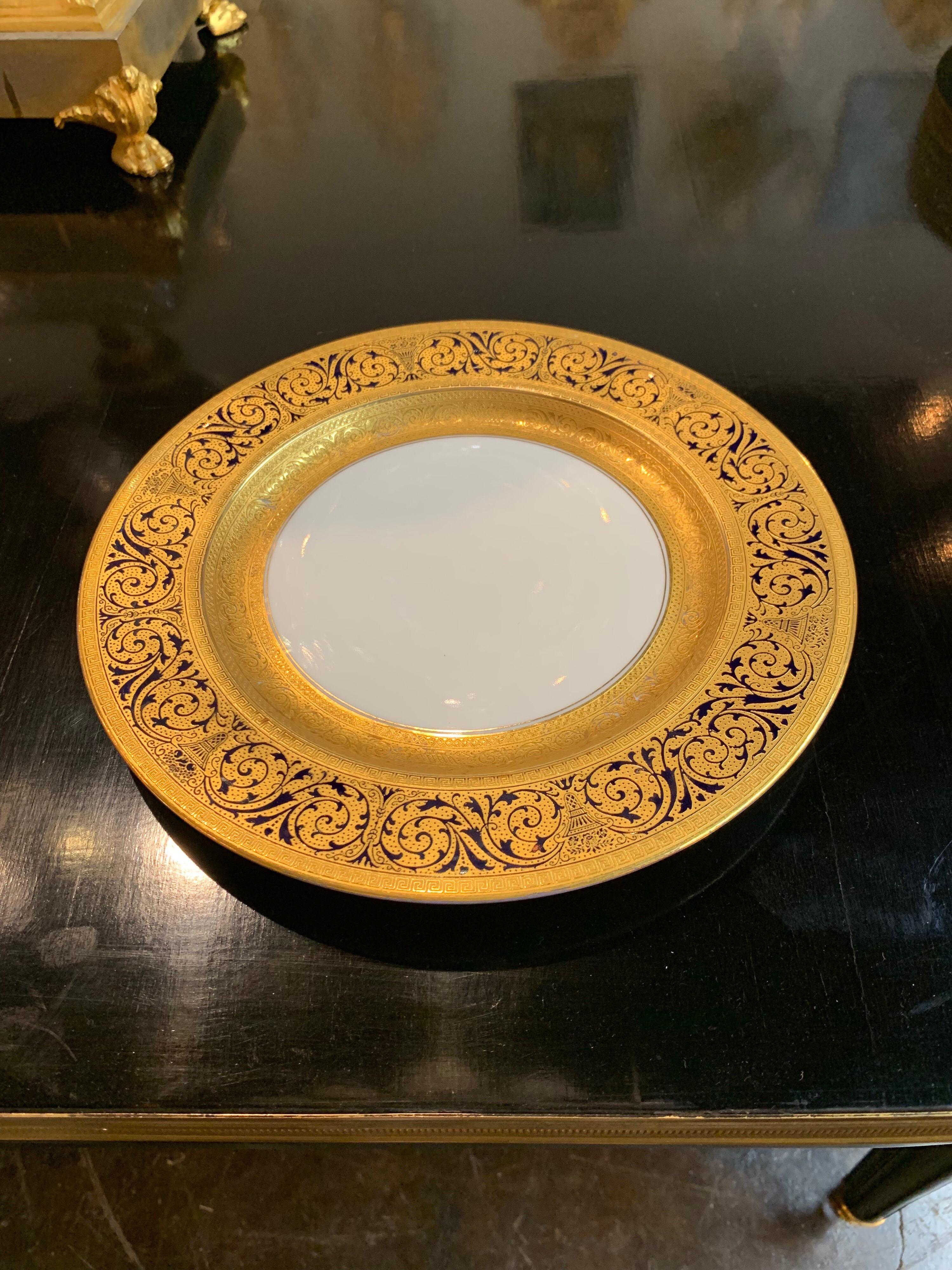 Fine set 12 Bavarian china dinner plates with raised 24 carat gold. Exceptional quality.
Makes for a gorgeous dining table. Superb!