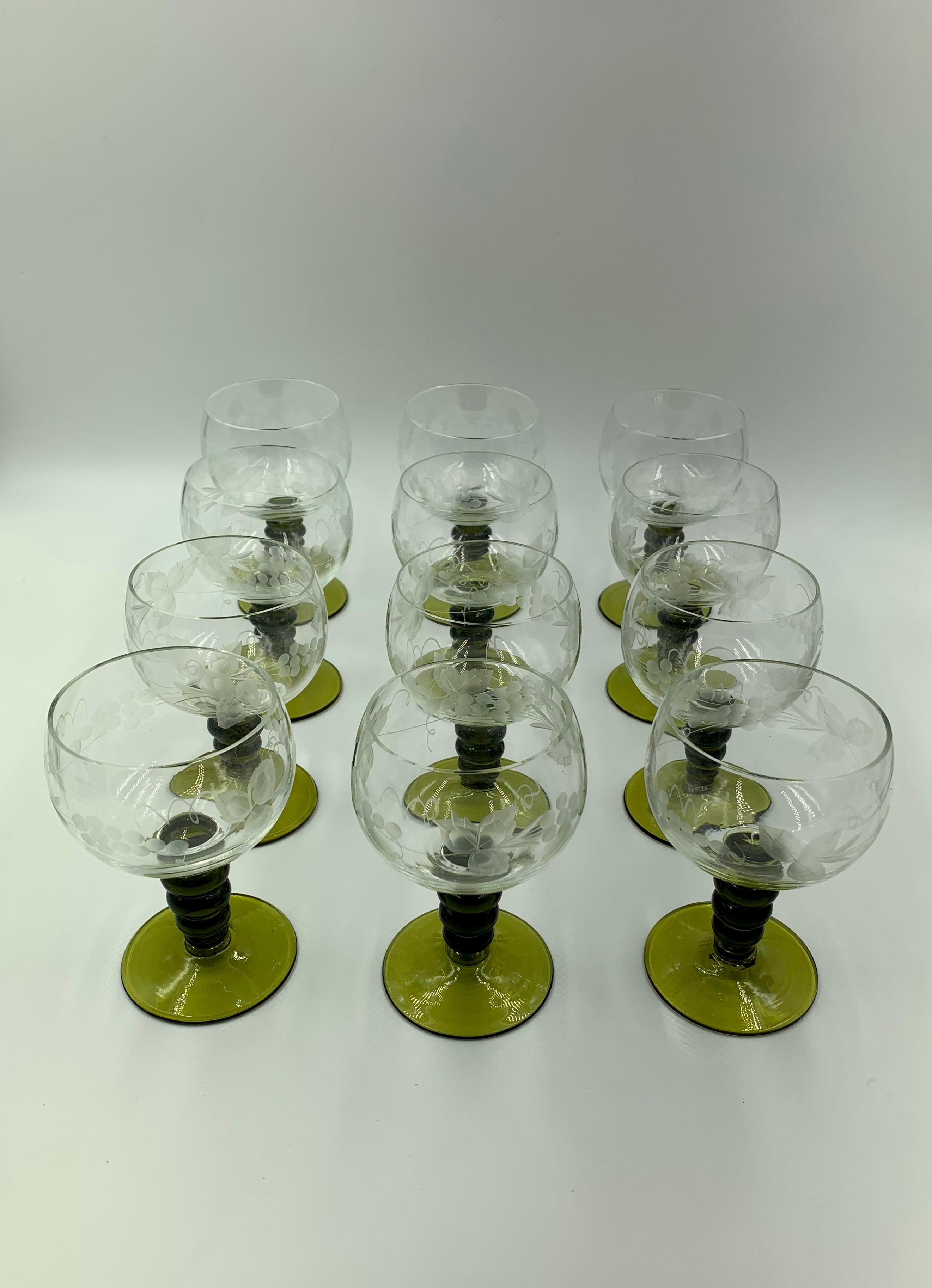 European Set of 12 Bohemian Rhine Wine Glasses, Engraved Grapevine motif with Green Stem For Sale