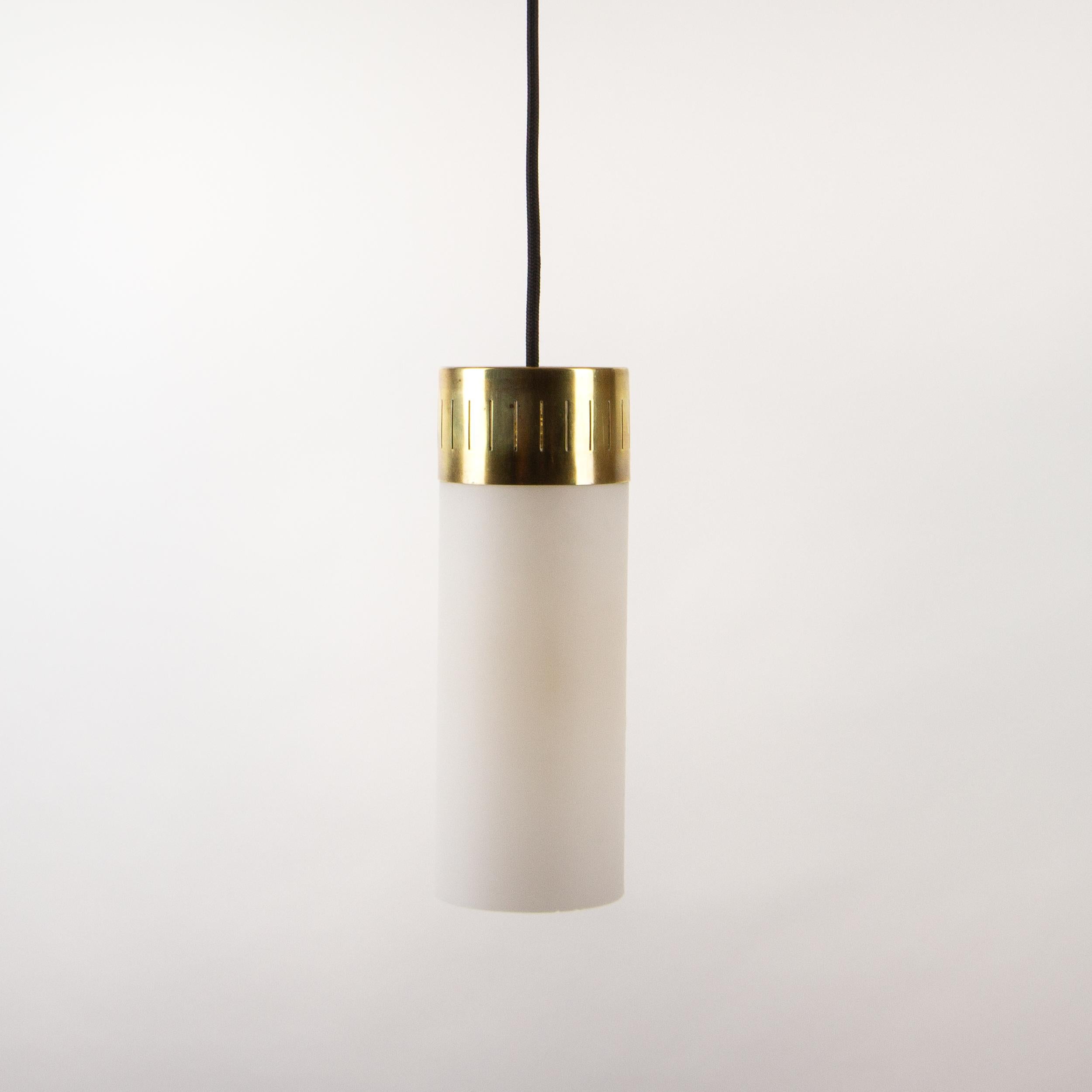 Italian brass and opaque glass tubular hanging pendant lights. Imported from Italy during the 1940s for an Italian restaurant on the Kent coast, the owners couldn’t find the style they wanted in the U.K. so went back to Italy for all the furnishings