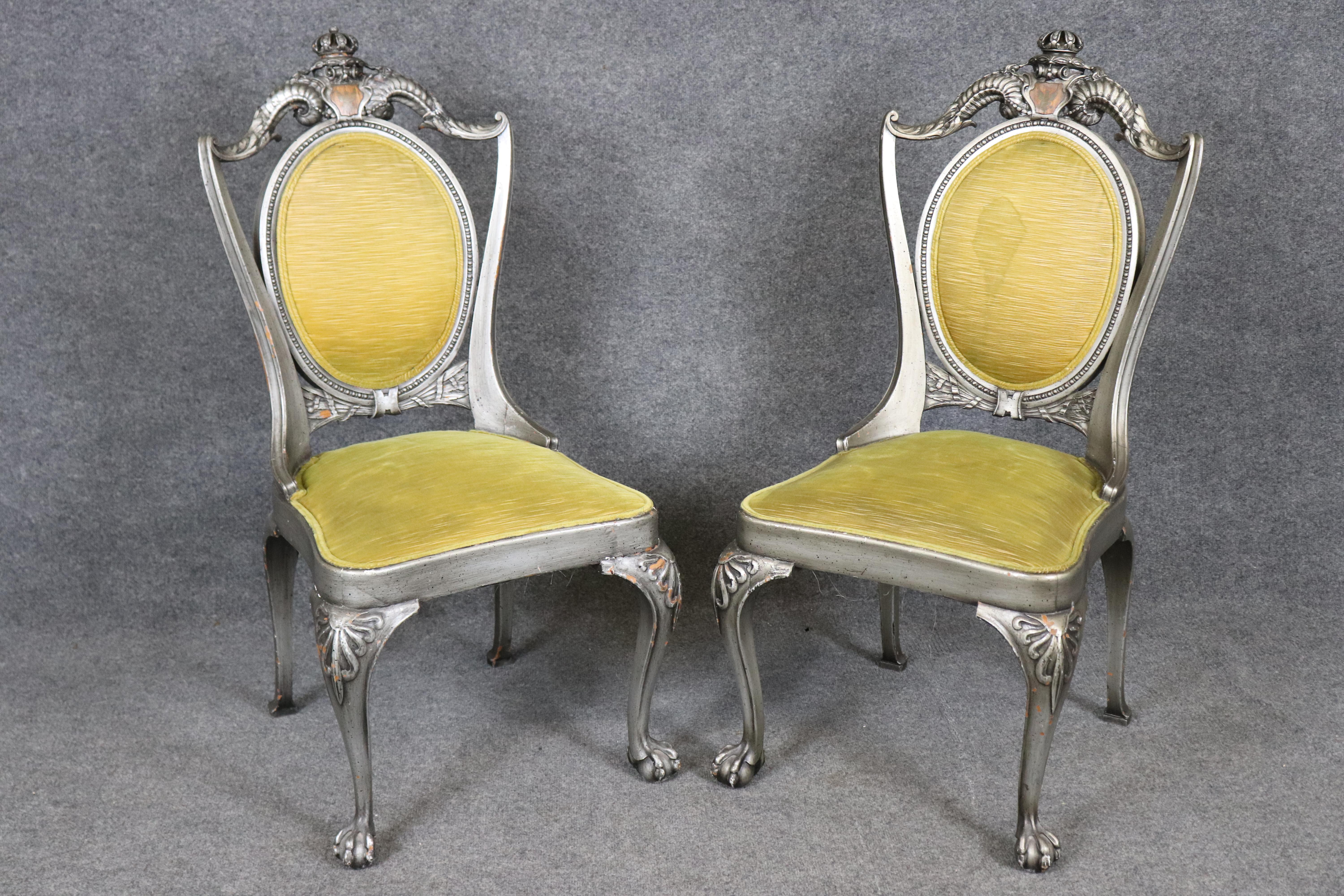 This impressive set of twelve French Louis XV style dining chairs offers both grandeur and functionality, making them ideal for a formal dining room or elegant entertaining space. Crafted with exquisite carved frames, the chairs showcase the