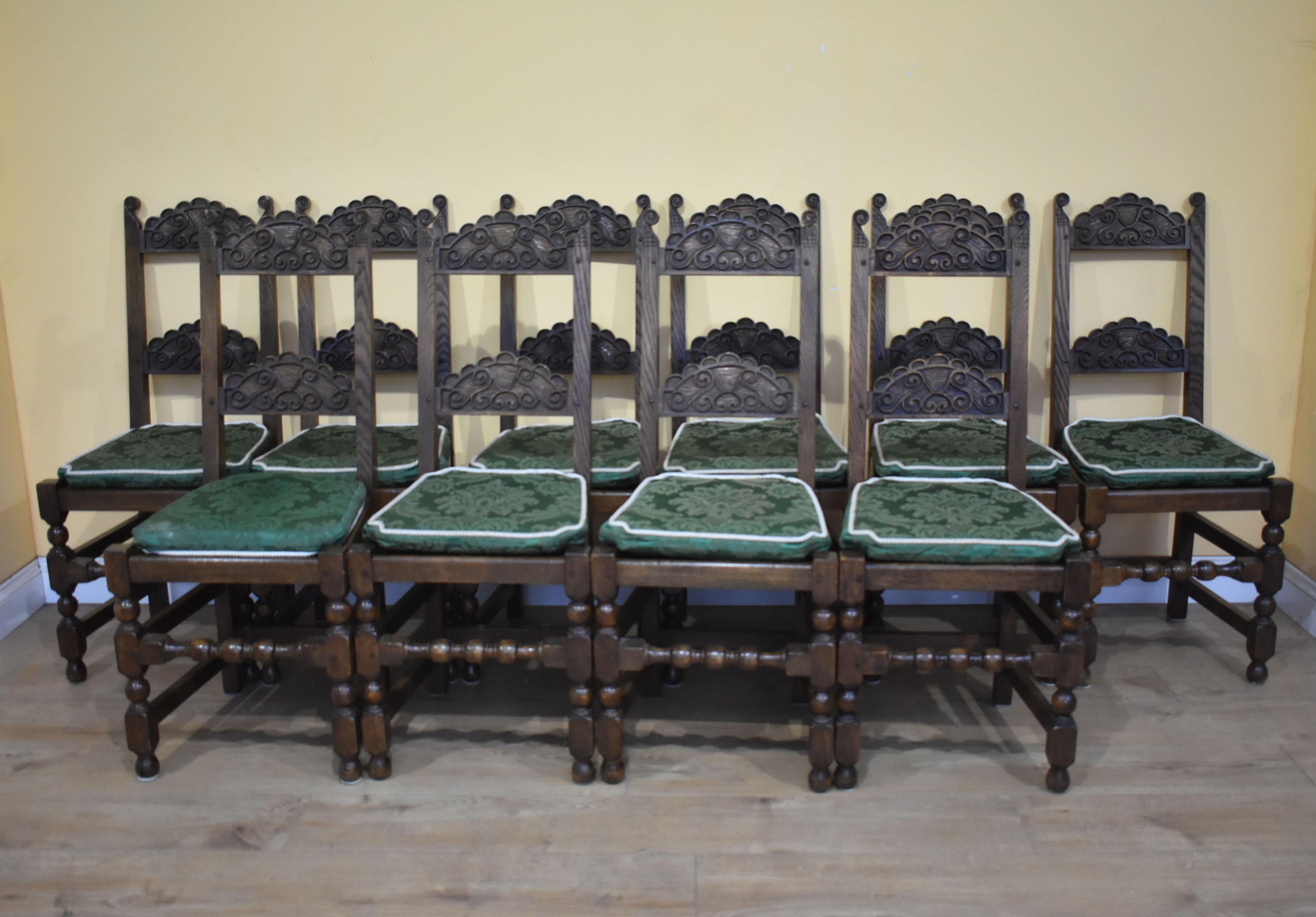 For sale is a good quality set of 12 carved oak dining chairs. Each chair has two carved back rails and Stand on turned legs, united by straight and turned stretchers. Each chair is made from solid oak and remain structurally sound and in very good