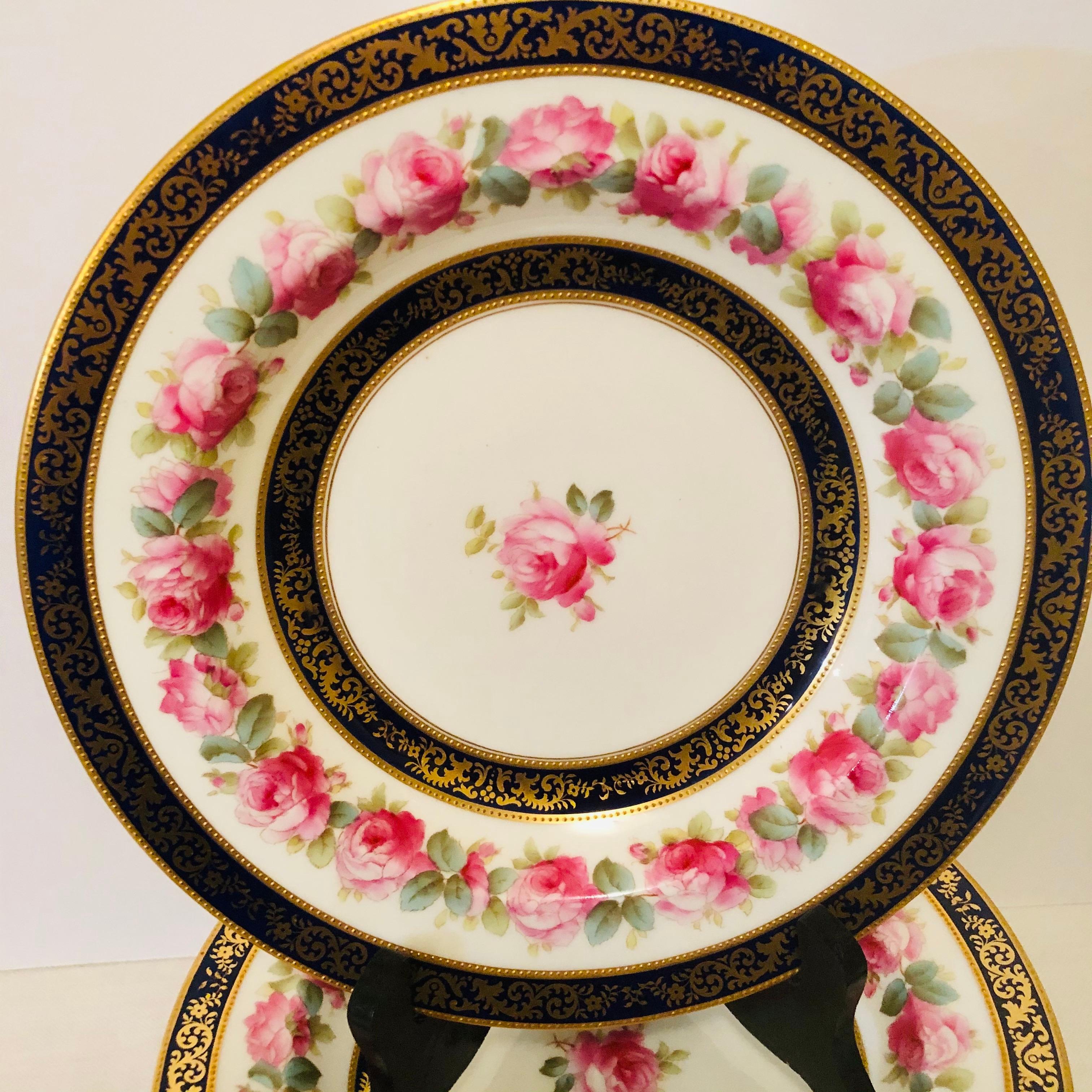 20th Century Set of 12 Cauldon Wide Rim Soups with Pink Rose Paintings and Two Cobalt Borders For Sale
