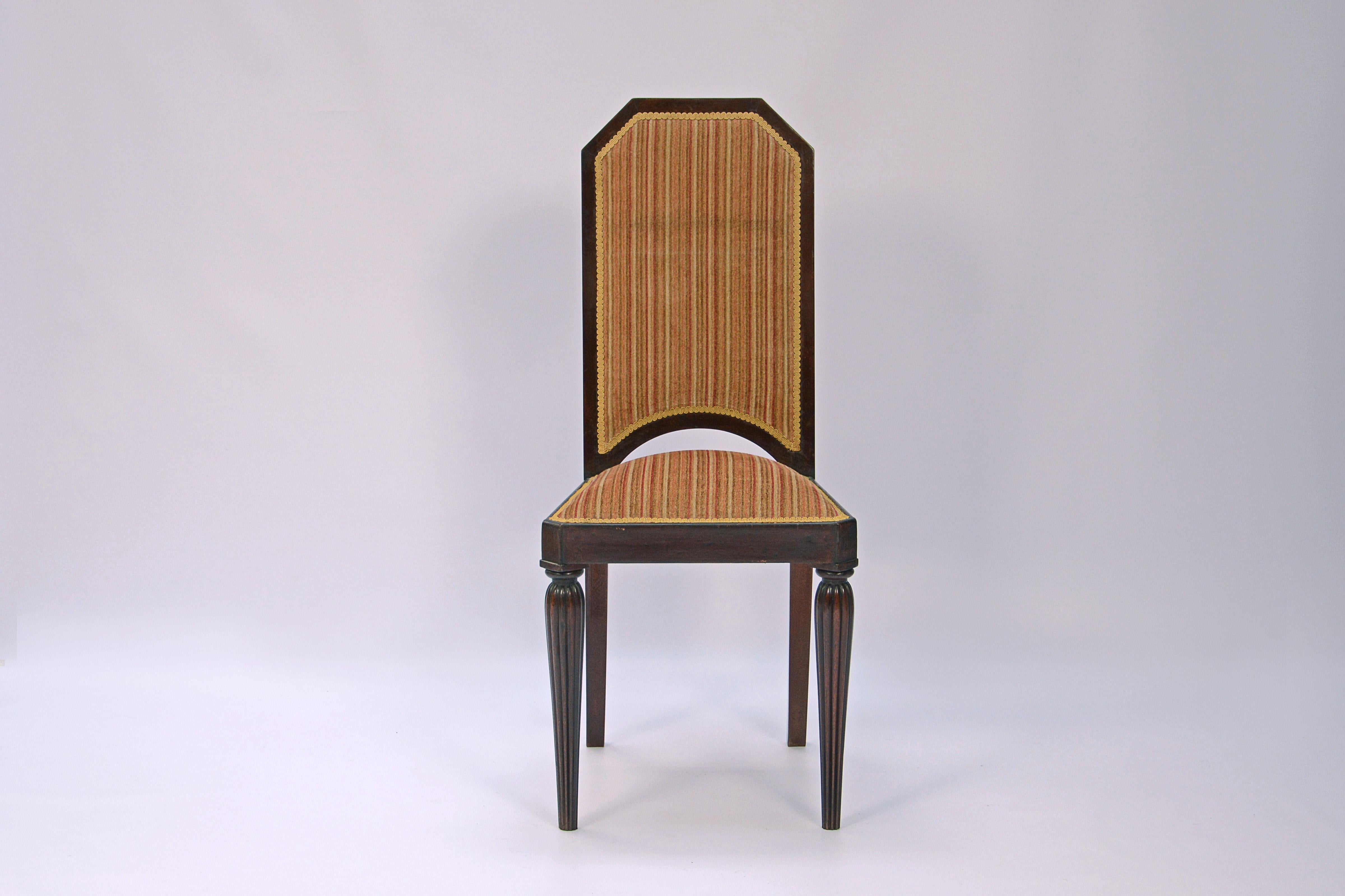 Set of 12 chairs designed by Maurice Dufrene (1876-1955). Walnut wood and cloth upholstery.

Wall mirror, table with 2 extentions, showcase cabinet and shelves cabinet.

France, CIRCA 1920