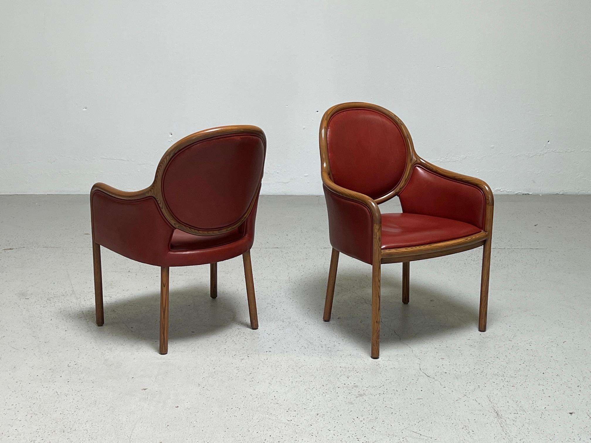 A set of twelve armchairs designed by Ward Bennett for Brickel. Ash frames with original brick red doeskin leather. 