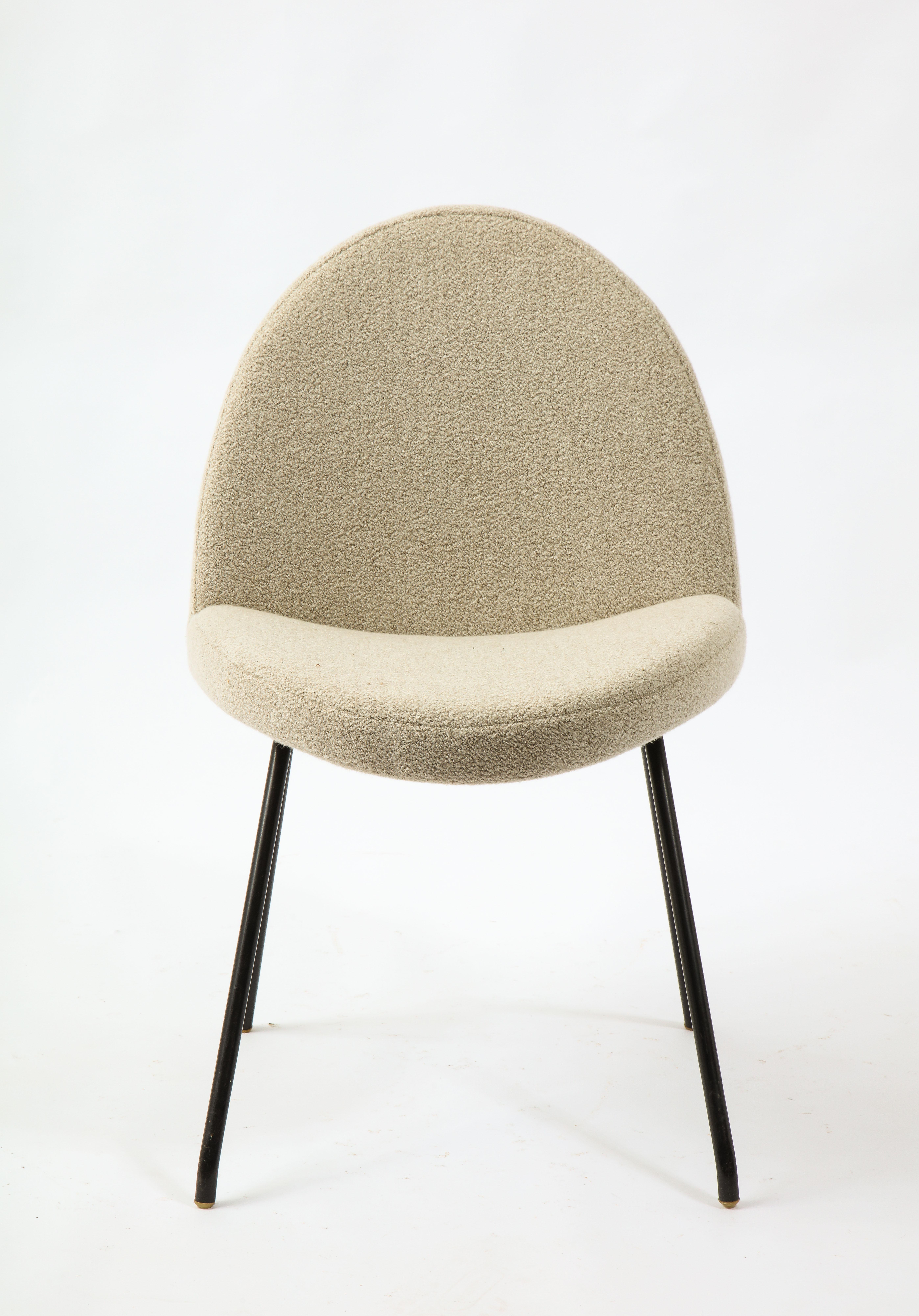 Twelve chairs model 771 by Joseph Andre Motte for Steiner, upholstery over maple on black enameled steel base. Only one chair finished in bouclé for display. Set is COM.