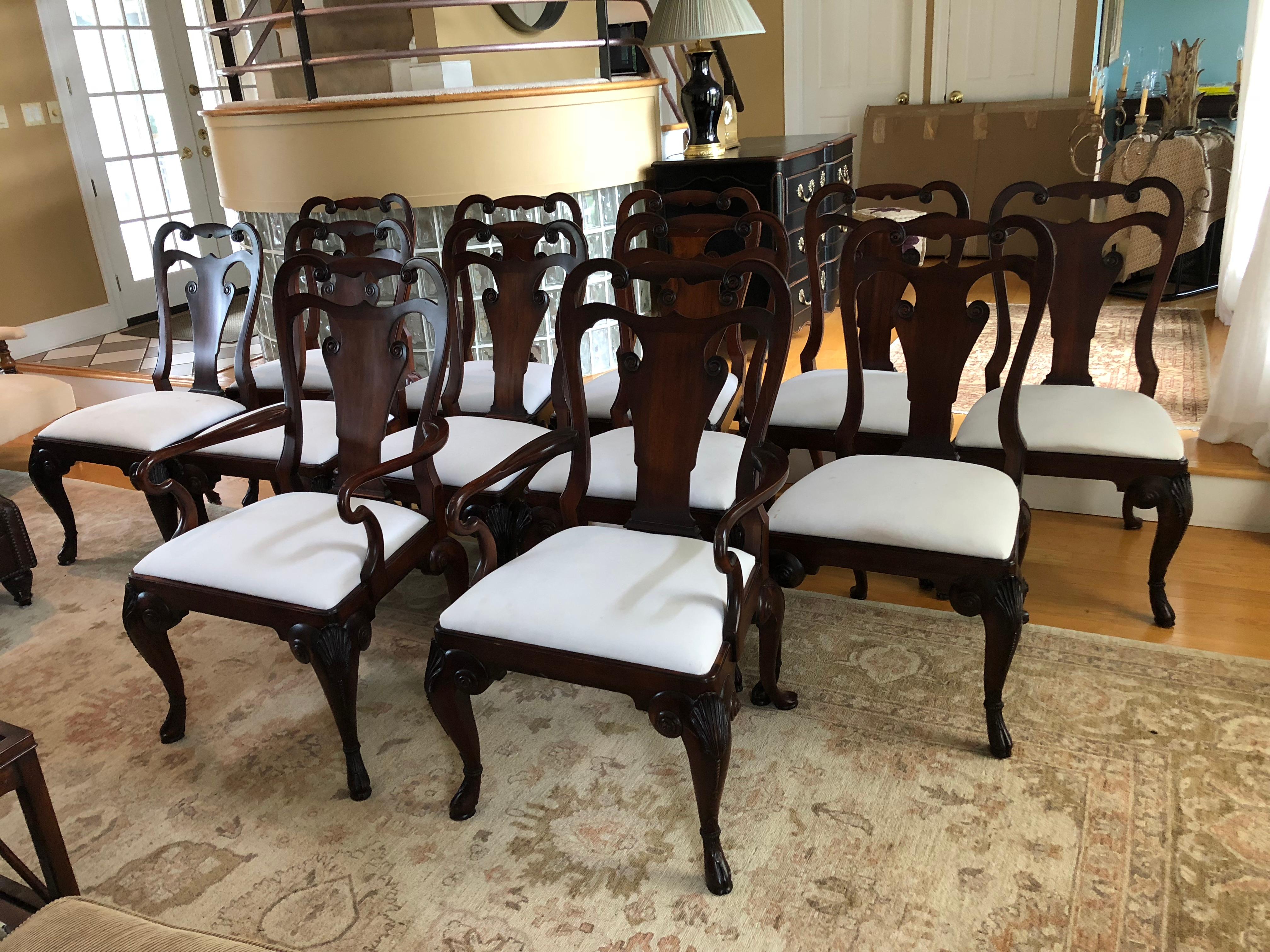Set of 12 rich mahogany Ralph Lauren for Henredon Beekman dining chairs that includes 2 arm chairs and 10 side chairs. Timeless, Classic style and very comfortable.
Seat padding is fully intact and in great condition except for some age appropriate