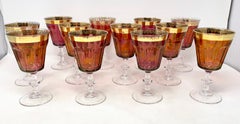 Set of 12 Cranberry Glass and Wide Gold-Rimmed Wine Goblets.