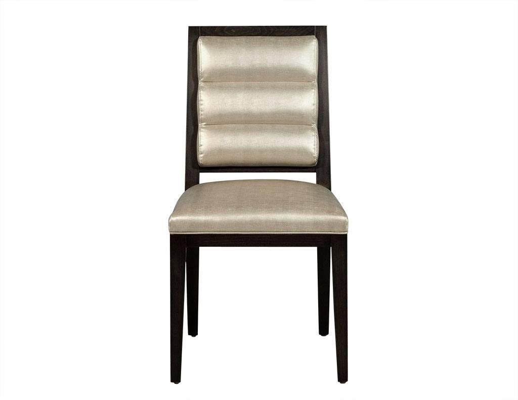 These made to order dining chairs are part of the Carrocel Custom collection.  They are composed of an art deco roll-back backrest with the seats and backrests upholstered in a pale taupe shiny satin cloth with a different patterned fabric on the