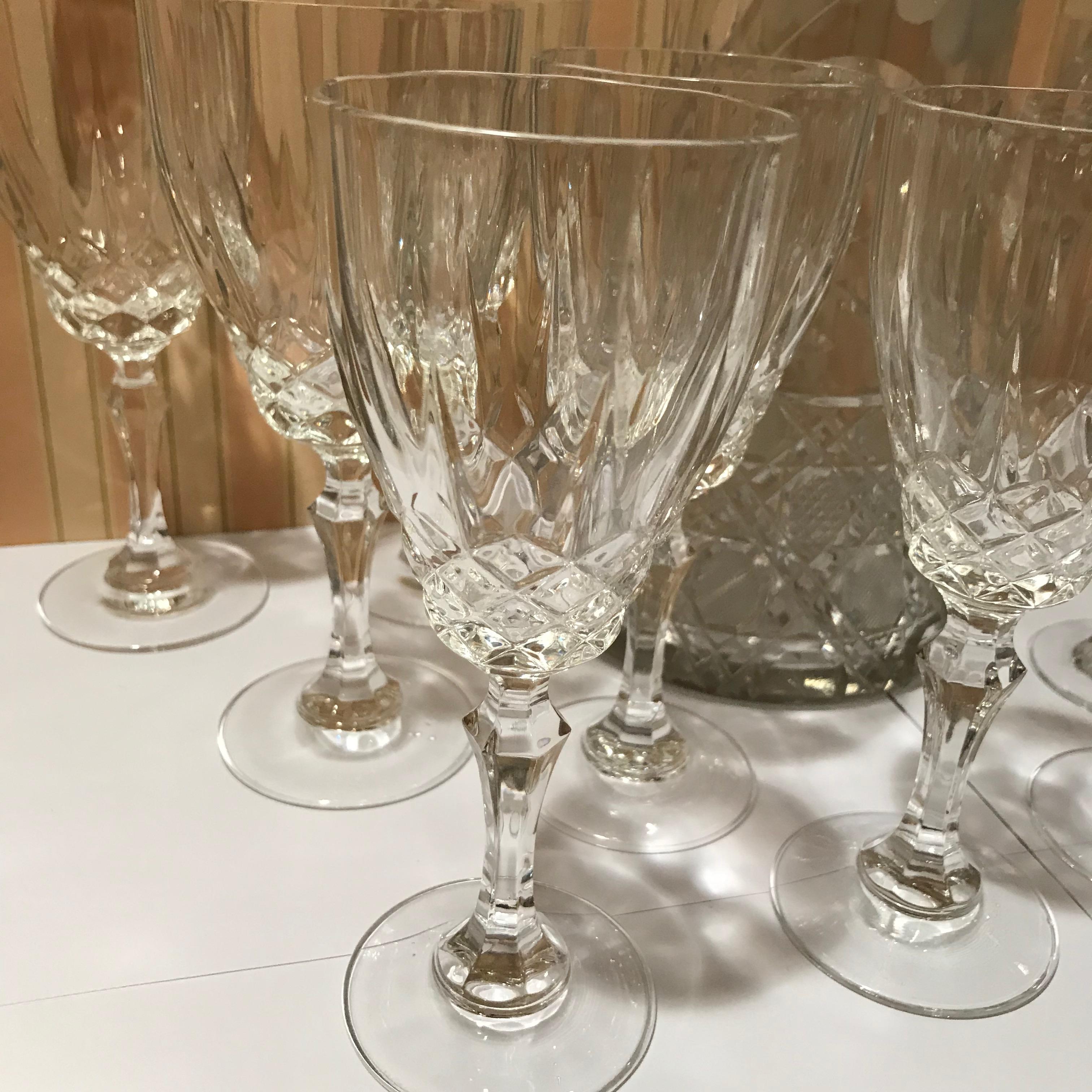 Set of 12 cut crystal stemware, six goblets and six wines along with a cut and etched crystal pitcher, 12