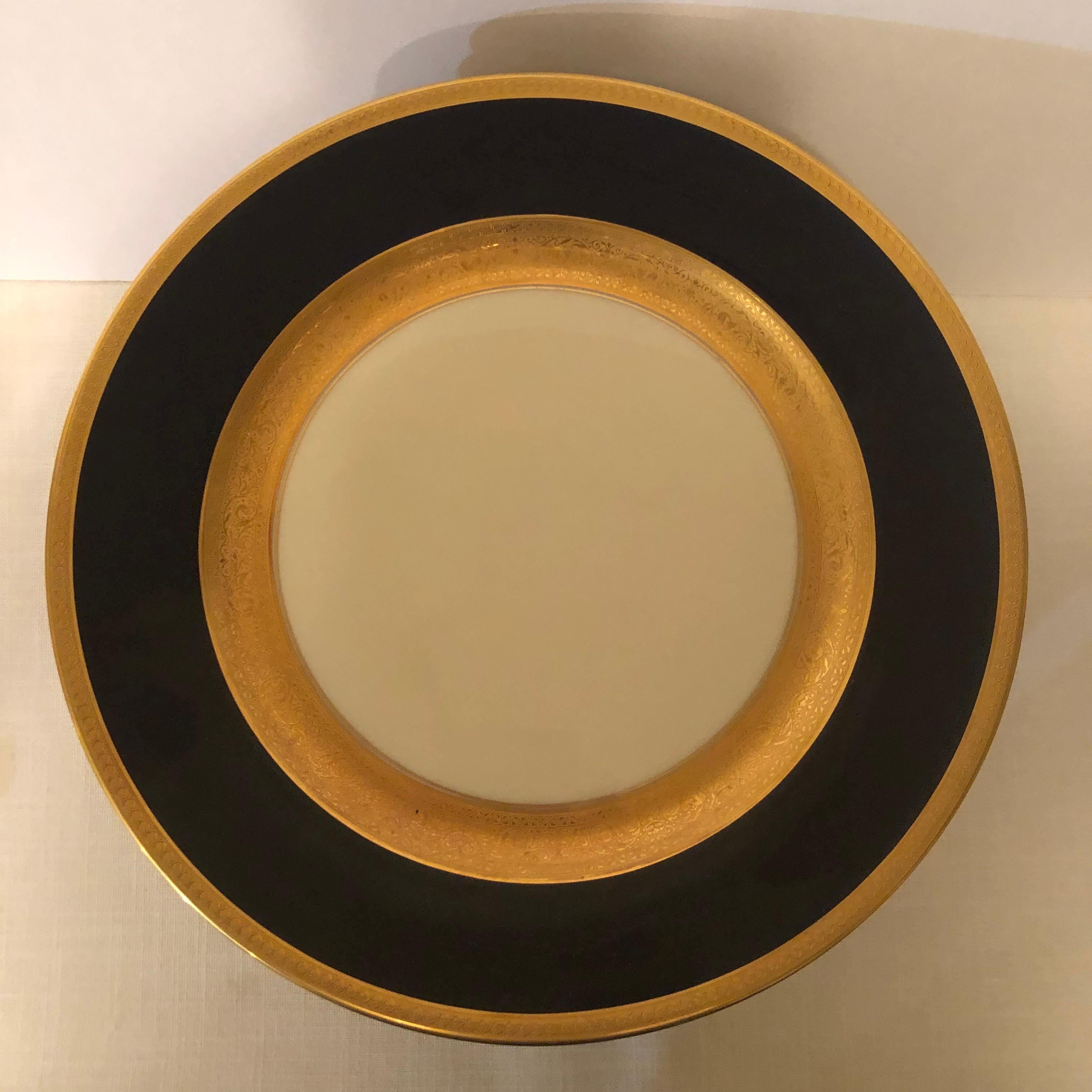 We are offering you this beautiful set twelve Royal Ivory Czechoslovakian cobalt and gold dinner plates. They definitely exemplify simple elegance on your dinner table. They are decorated with a circle of thick cobalt, which is surrounded by two