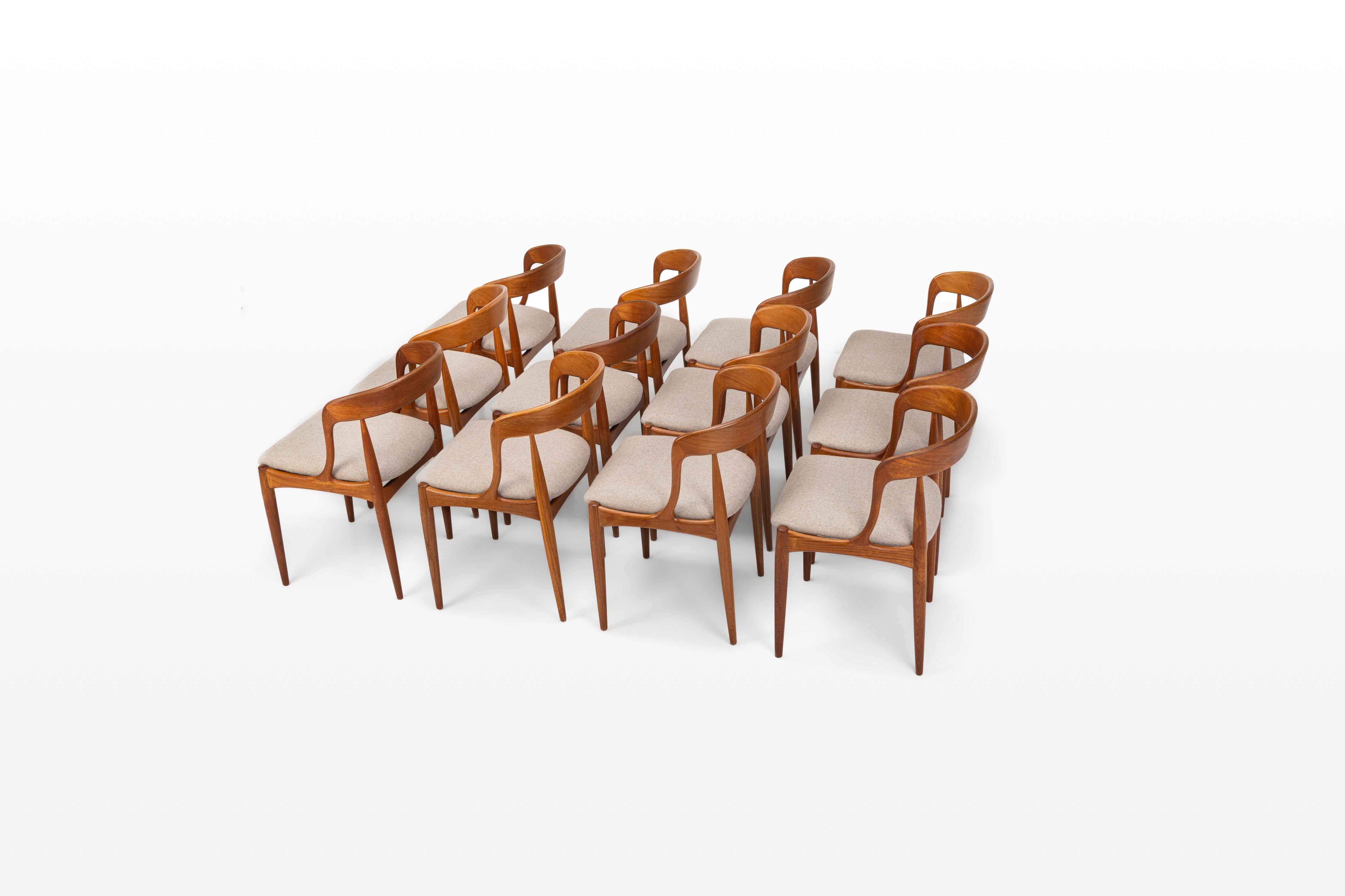 Set of twelve vintage 'Model 16' dining room chairs. These chairs are designed by Johannes Andersen for Uldum Møbelfabrik in Denmark. They have a teak frame and are reupholsted with a cream beige fabric by Aristide (Qashqai 255 Mocka - Aristide).